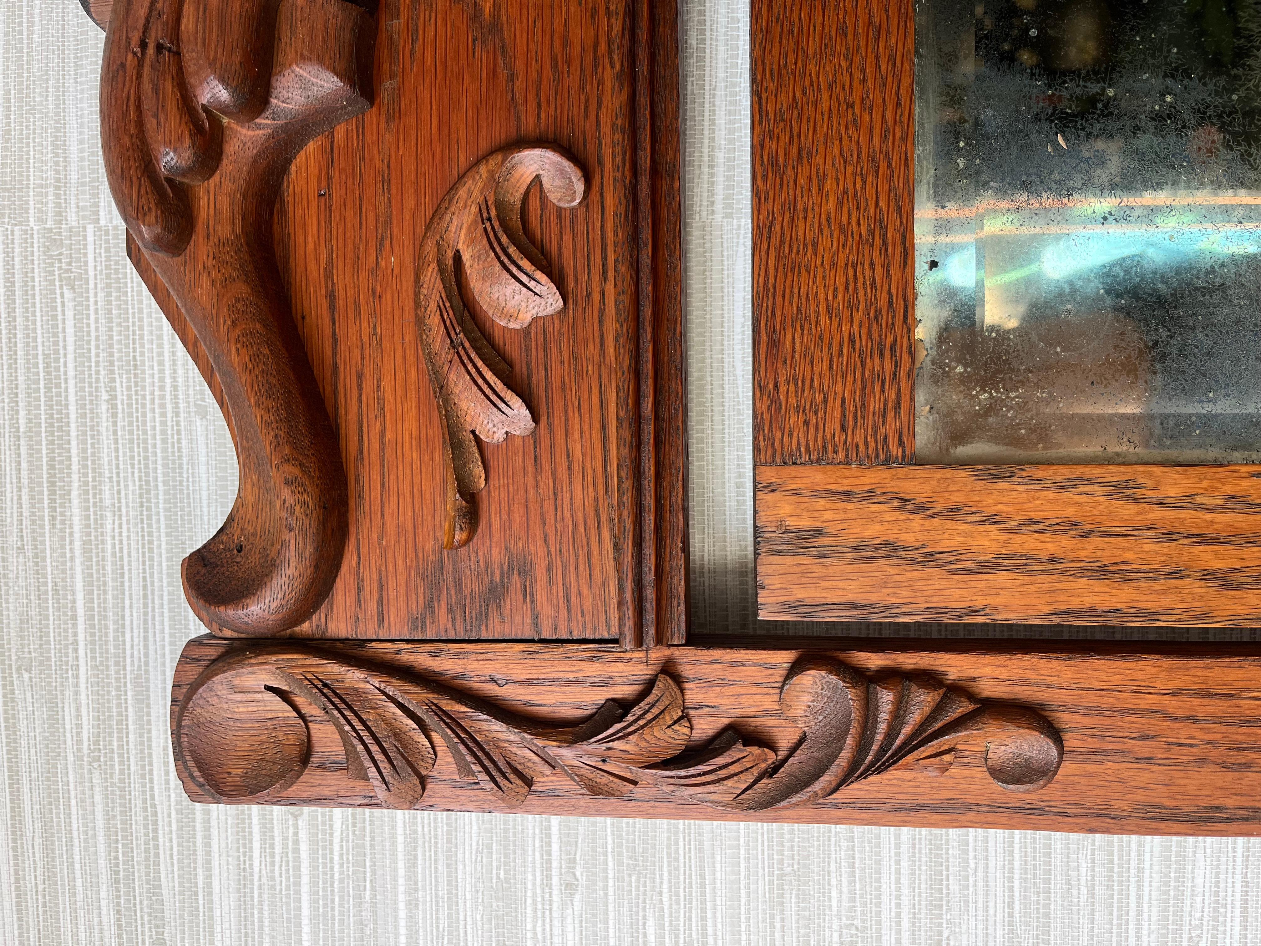 Antique Hand Carved Oak Early 1900s Victorian Era 4 Drawer Mirrored Dresser In Good Condition For Sale In Chesapeake, VA