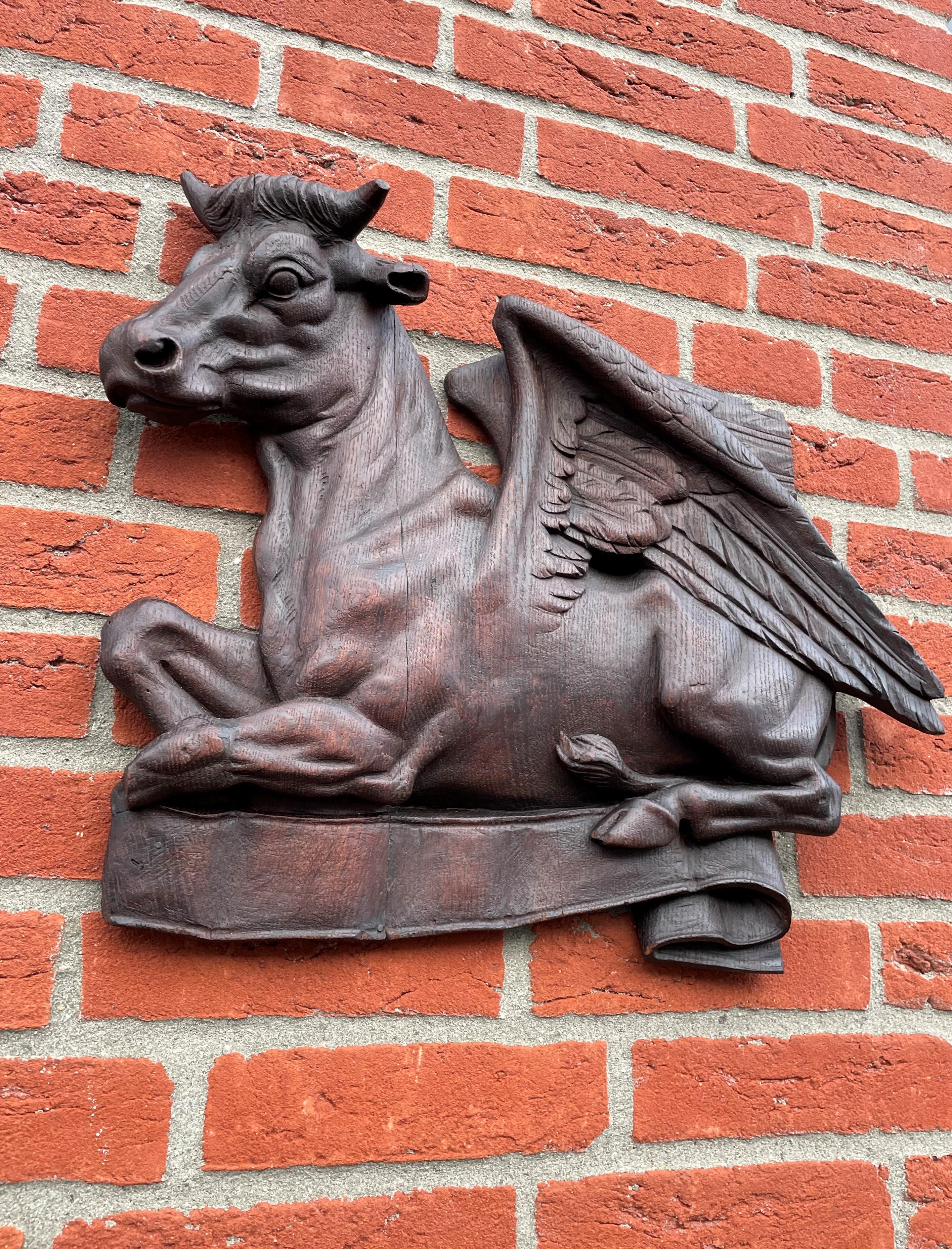 Unique and amazingly hand carved Saint Luke symbol wall sculpture.

This relatively large, hand carved Gothic Revival wall plaque is another one of our recent rare finds. All hand carved out of thick and solid oak and with some of the best details