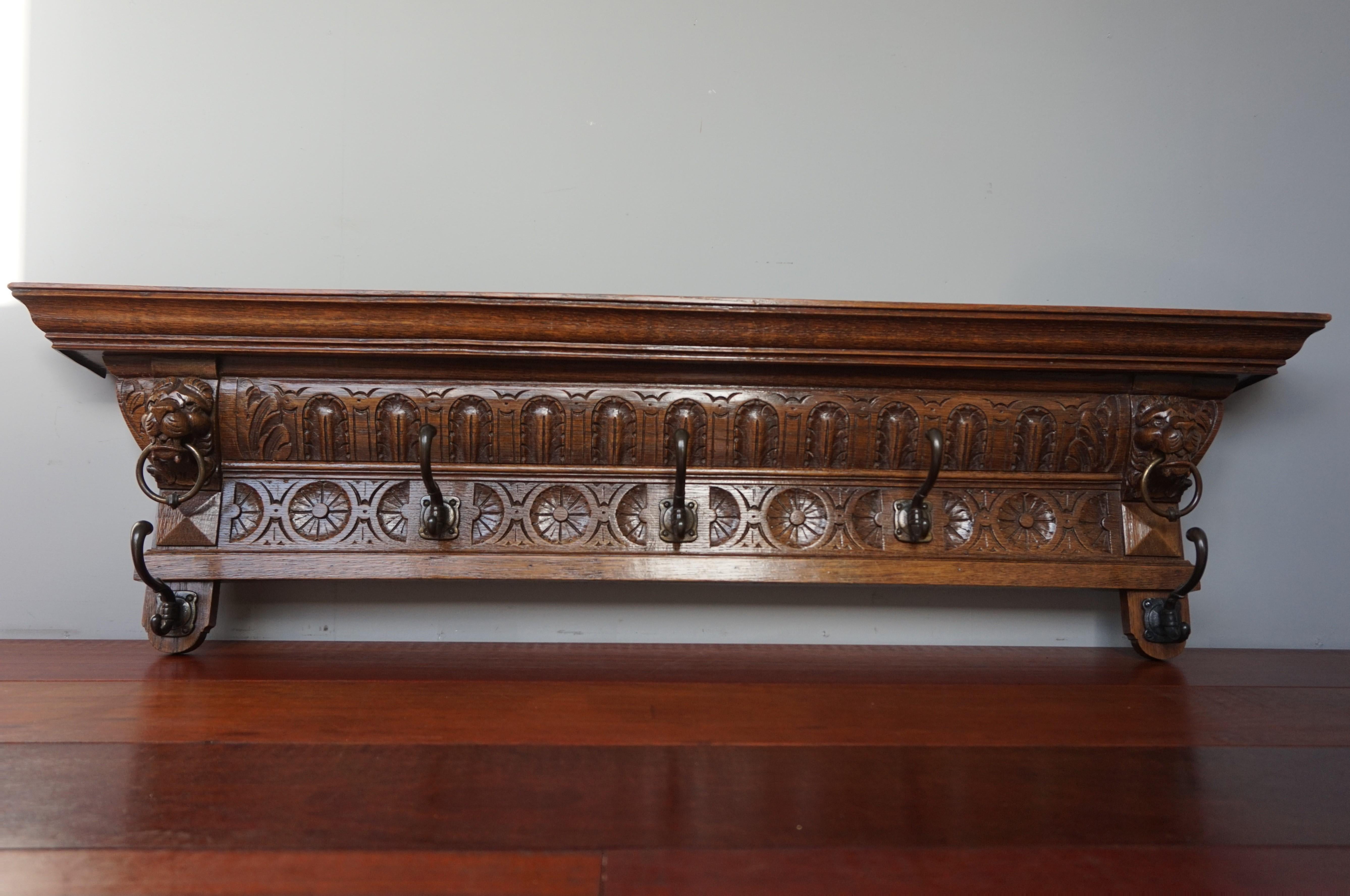 Early 1900s sculptural oak wall coat rack.

This striking antique Dutch coat rack is special, practical and highly decorative. It is special, because of the quality of the Renaissance carvings and its excellent condition. It is very practical,