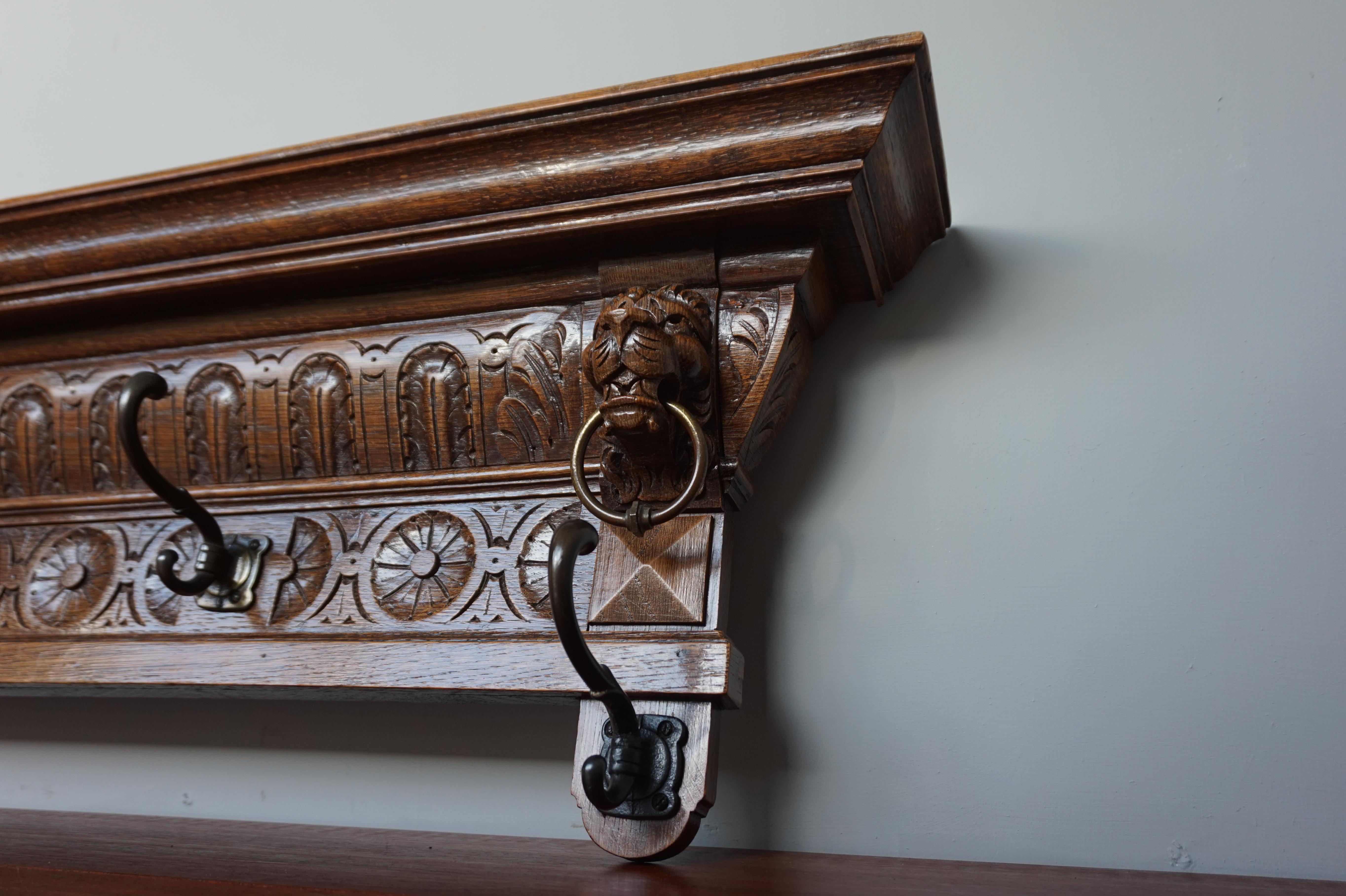 Hand-Carved Antique Hand Carved Renaissance Revival Wall Coat Rack with Lion Mask Sculptures