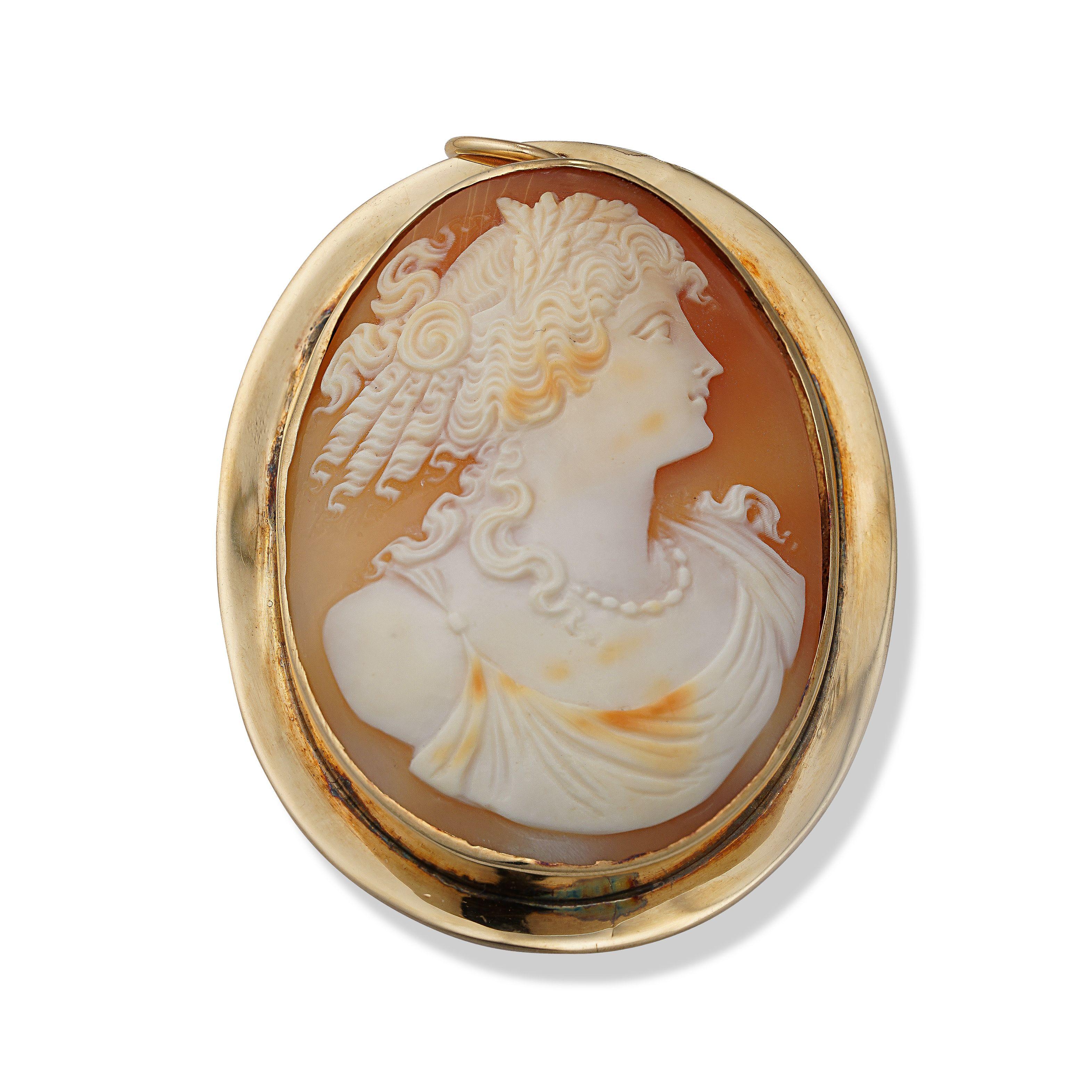 Simply Beautiful! Antique Cameo Brooch Pendant depicting a Beautiful Young Woman. The Hand Carved Oval Cameo is securely set in a Hand crafted 14K yellow Gold bezel mounting. Stamped: 14K. Versatile, the cameo can be worn as a pin or pendant.
