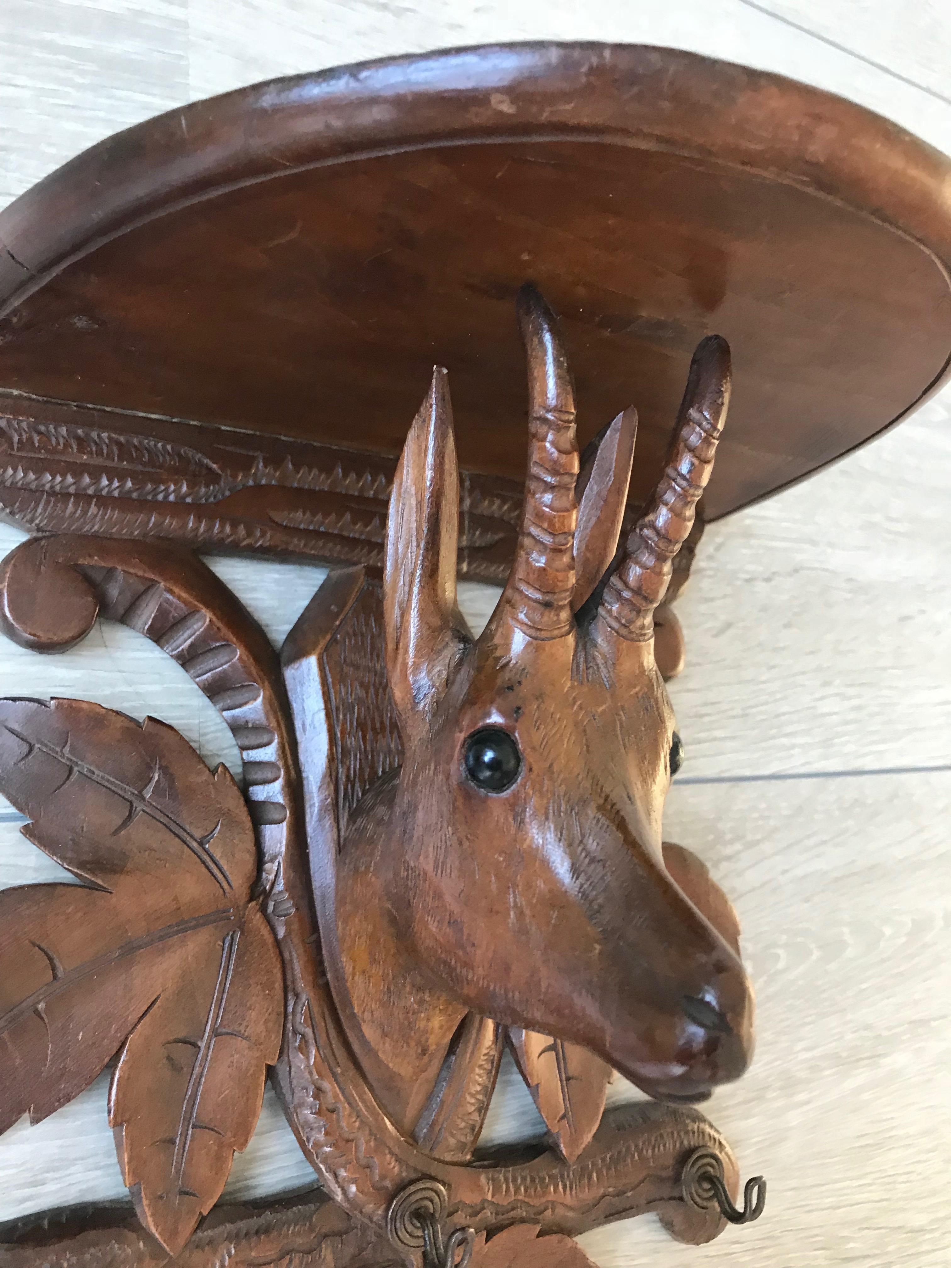 Rare and highly decorative Black Forest wall bracket. 

This quality carved Black Forest wall rack is another one of our recent great finds. The details in the stunning chamois head and the overall look and feel of this handcrafted antique reveals