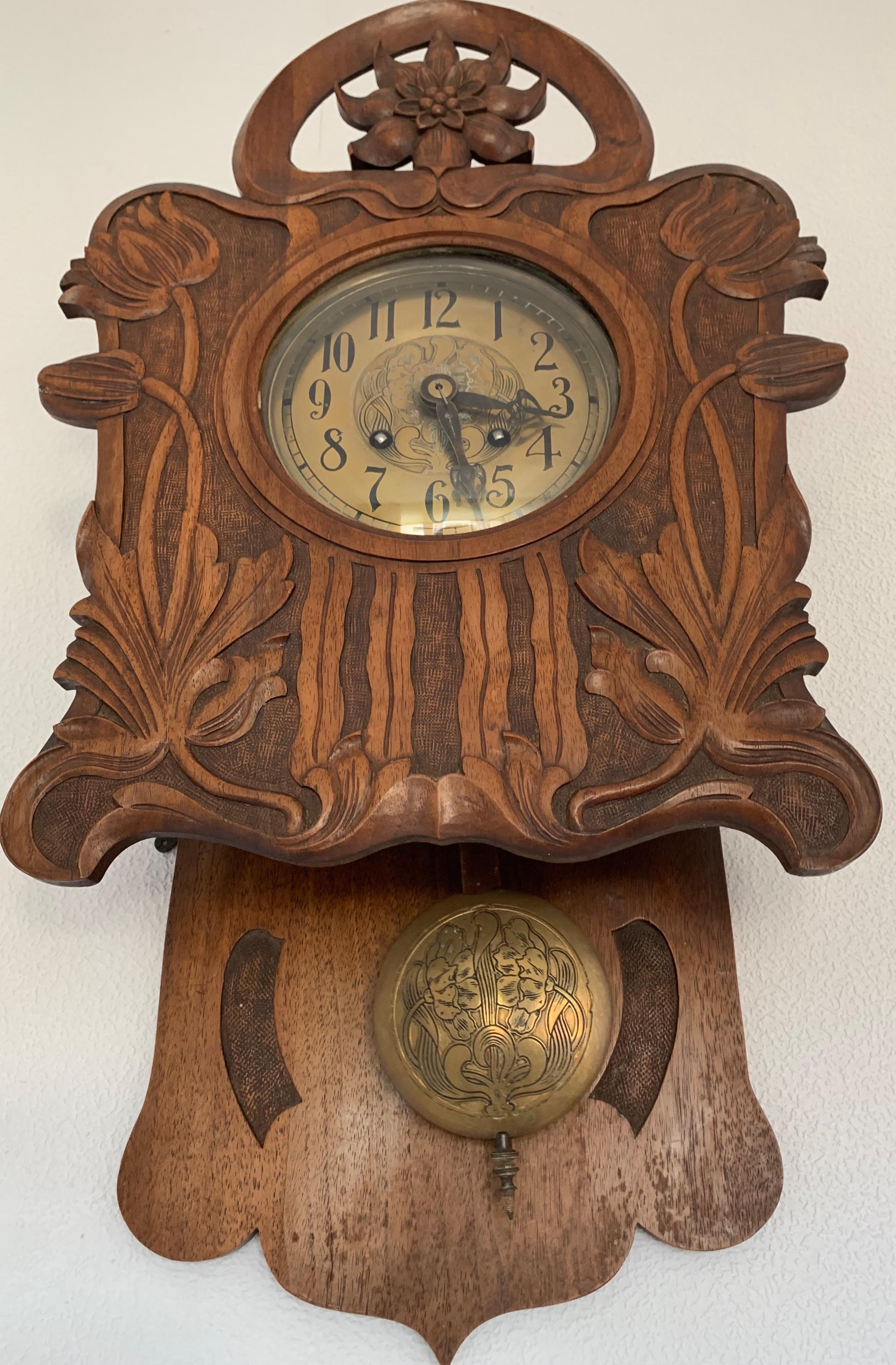 Early 20th century, great condition Jugendstil wall clock.

This hand carved and stunning Art Nouveau era clock has a beautiful color / patina and it is in wonderful condition, from top to bottom. The organic and floral carvings are exactly as you