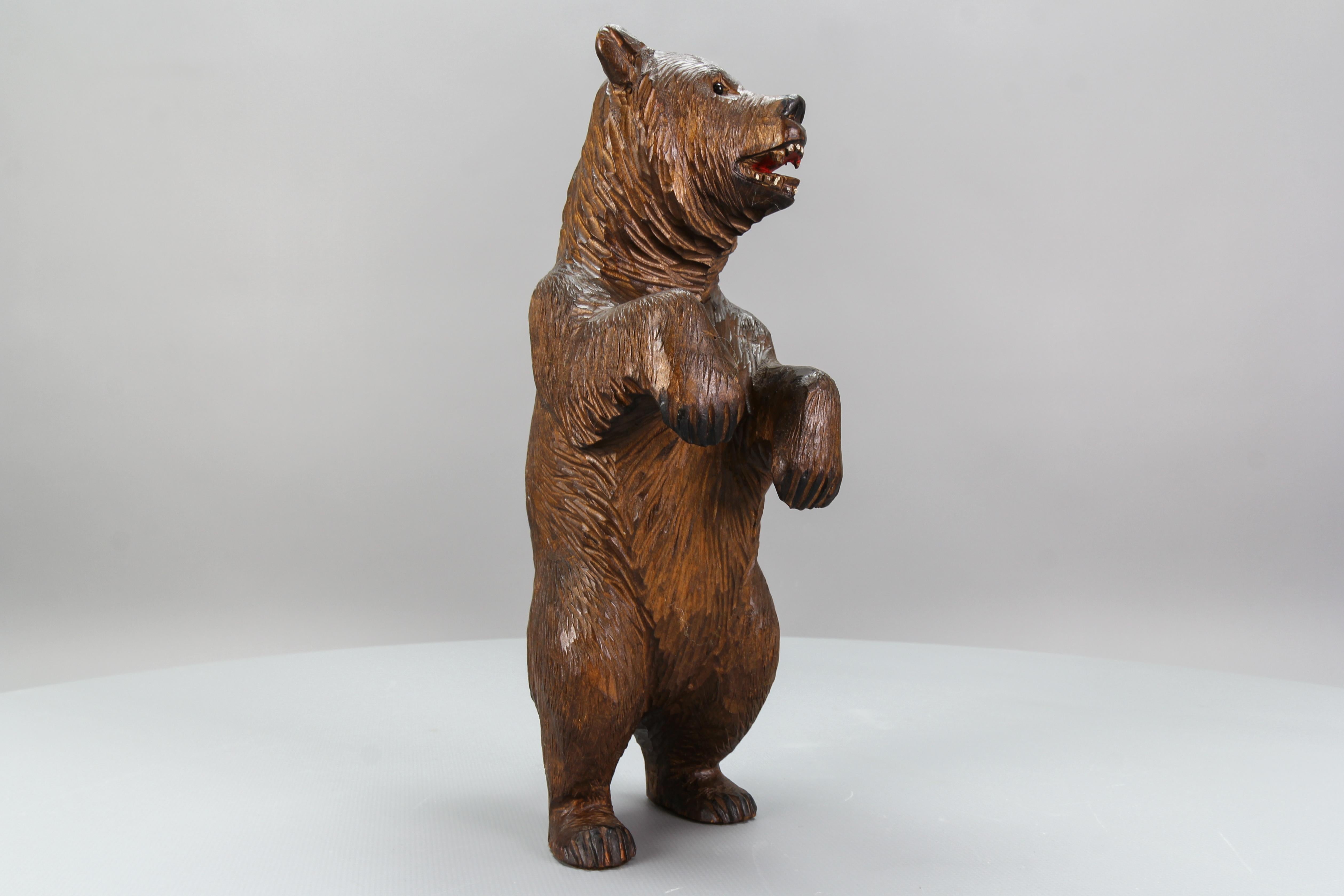 Antique hand carved standing bear sculpture.
A beautiful and masterfully hand-carved walnut figure of a standing bear, with highly detailed features and fur. Germany, circa 1920.
Dimensions, approx.: height: 29 cm / 11.41 in; width: 10 cm / 3.93
