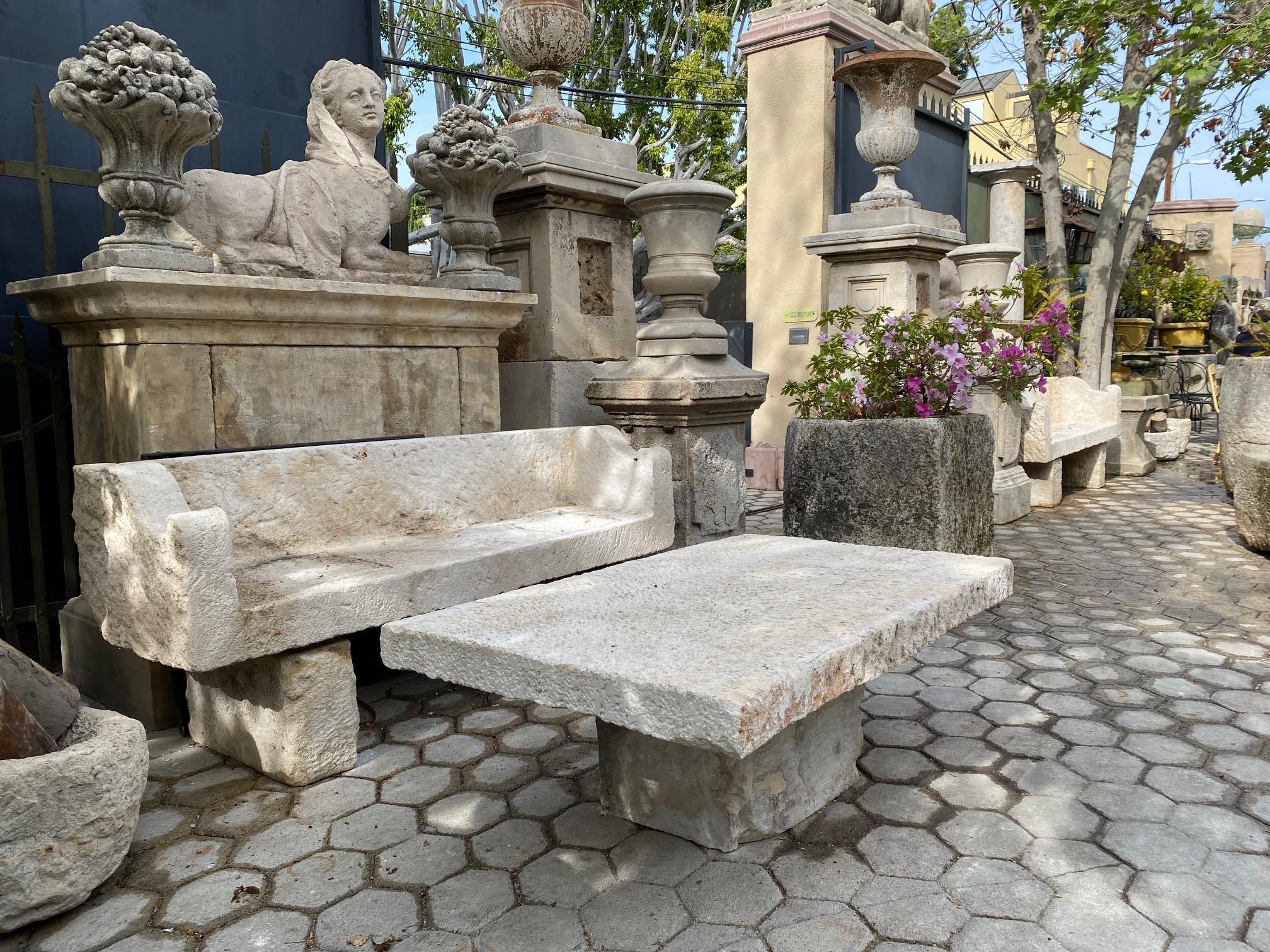 18th century hand carved stone antique elements garden low coffee Farm table on simple a single carved stone base pedestal.
It will be the perfect touch by an outdoor fireplace, This table has a lot of charm and character. It can work in a