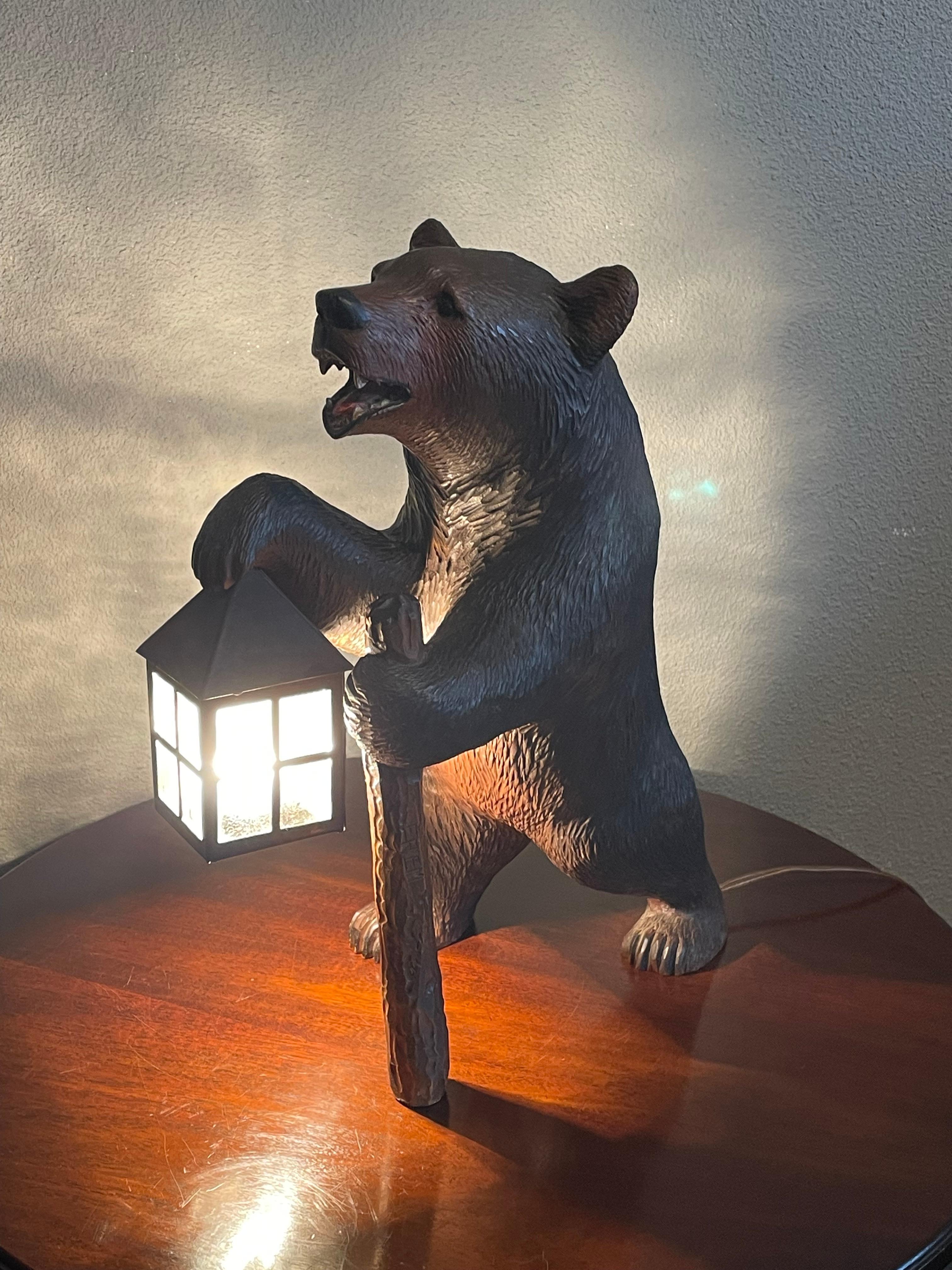 Rare and all original antique walking bear with lantern light and 'log-cane'.

If you are a collector of rare, very good quality, superb condition, all original and highly decorative Black Forest bear sculptures then this good size specimen with the