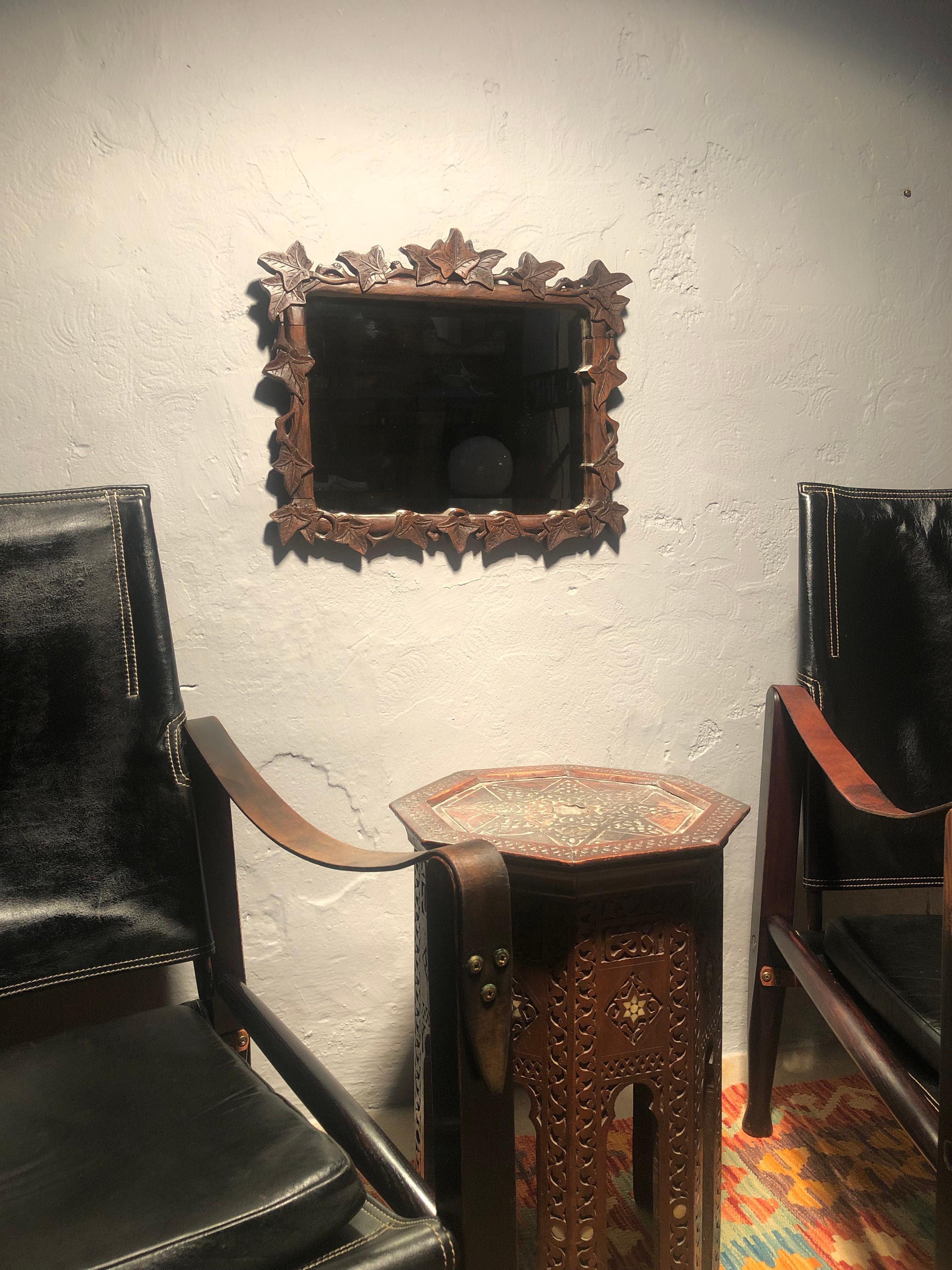 Antique wall mirror from the late 1800s.
This beautiful hand carved mirror is in original condition with the original beveled glass plate that has never been out of the frame and therefore it also maintains the original back plate. 
There is no