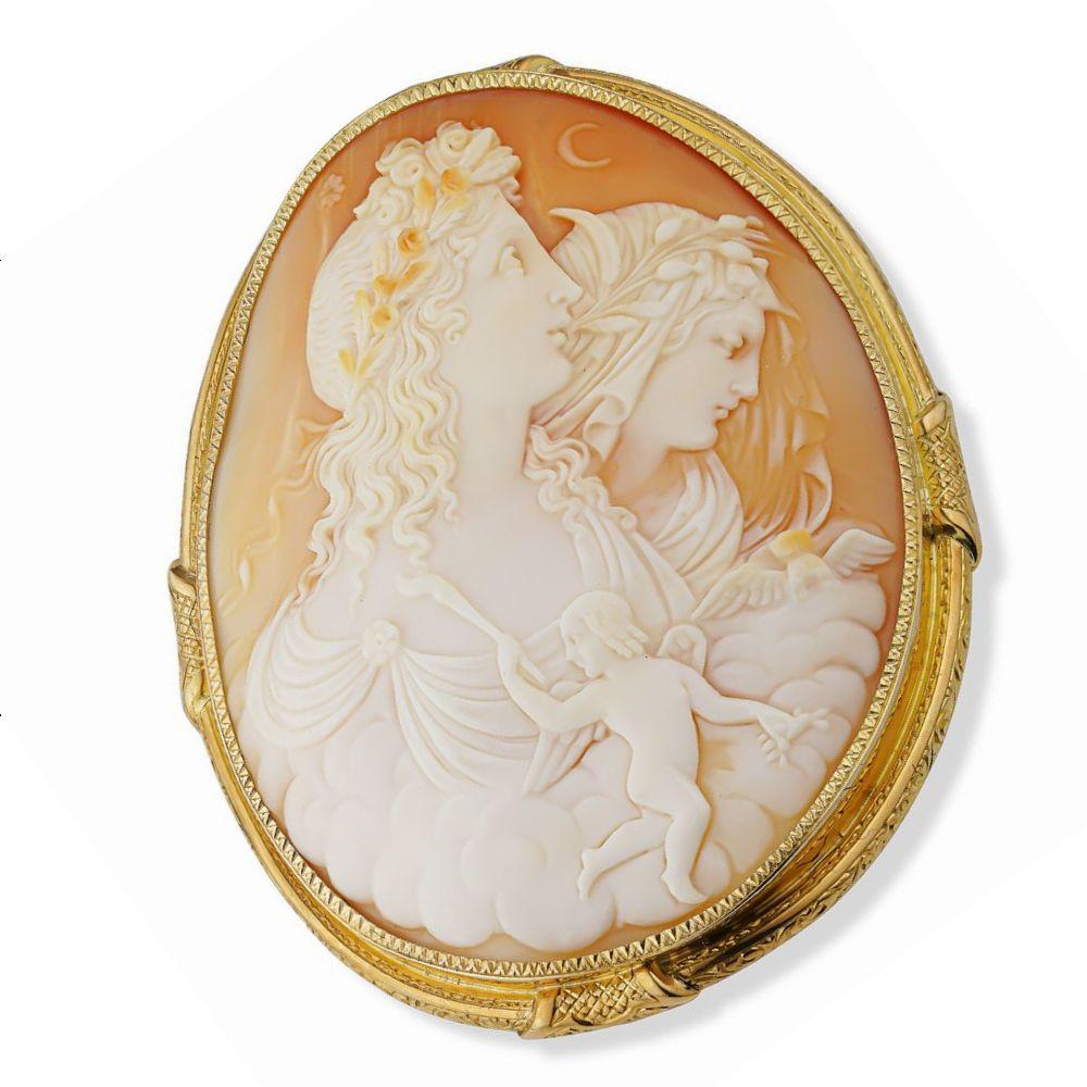 Simply Beautiful! Elegant and Stylish Antique Natural Carnelian Shell Cameo Brooch depicting a Cherub and 2 Beautiful Young Ladies. Hand Carved in High Relief. Awesome! Securely Hand set in exquisite Hand crafted 18K Yellow Gold bezel surround