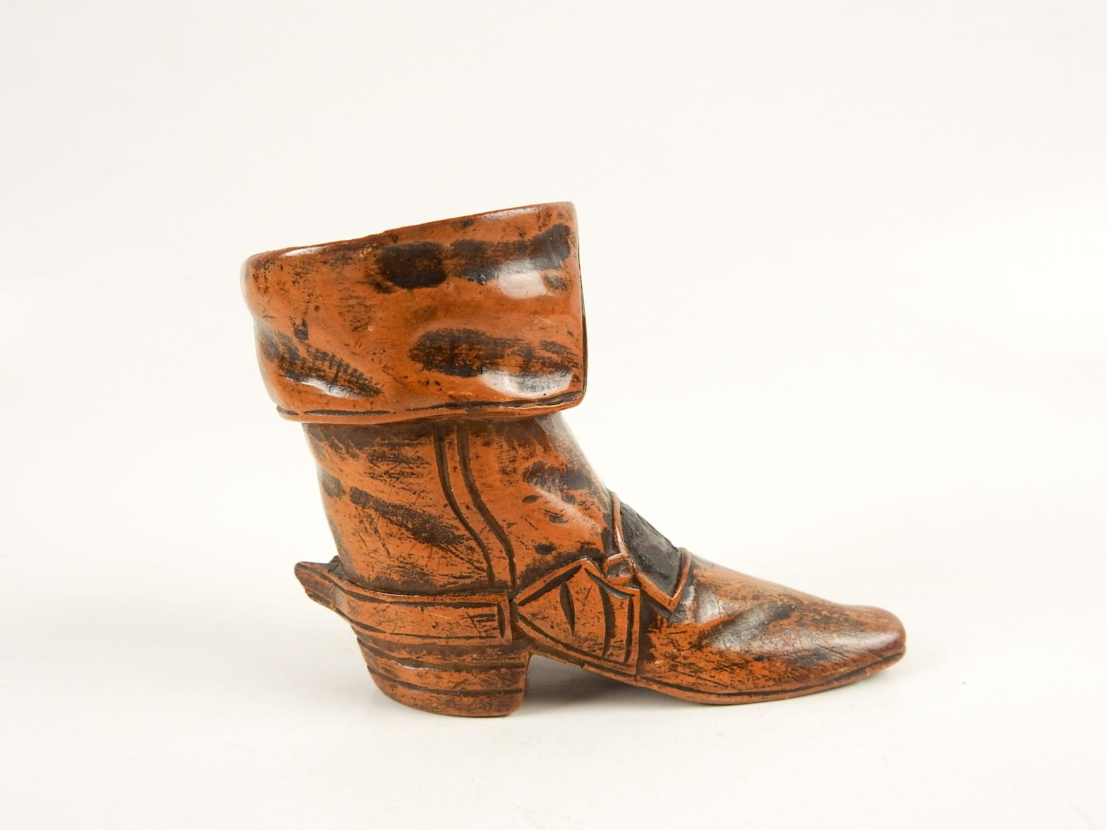 Circa 1890's hand carved wood match striker and holder.  In the shape of 17th Century syle boot, think 3 Muskateers.  Buckle area is rough for striking, soft sheen to finish, tip of spur missing.