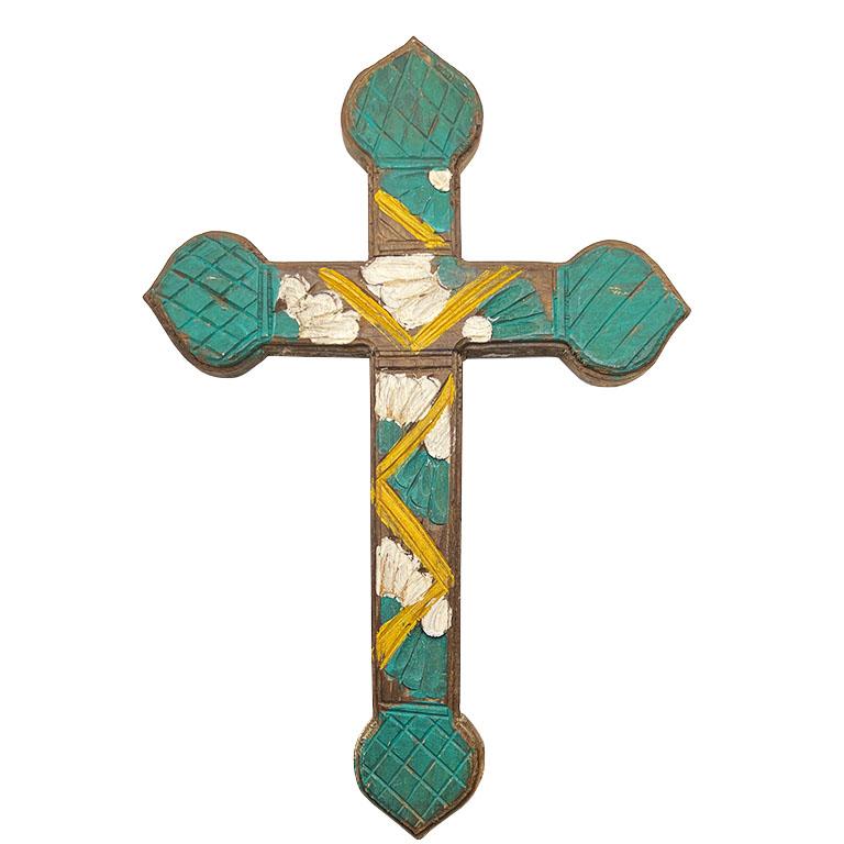 This antique Mexican wooden cross is a striking example of traditional craftsmanship, blending religious significance with vibrant folk art. The cross features a hand-carved design with intricate details and original hand-painted floral motif