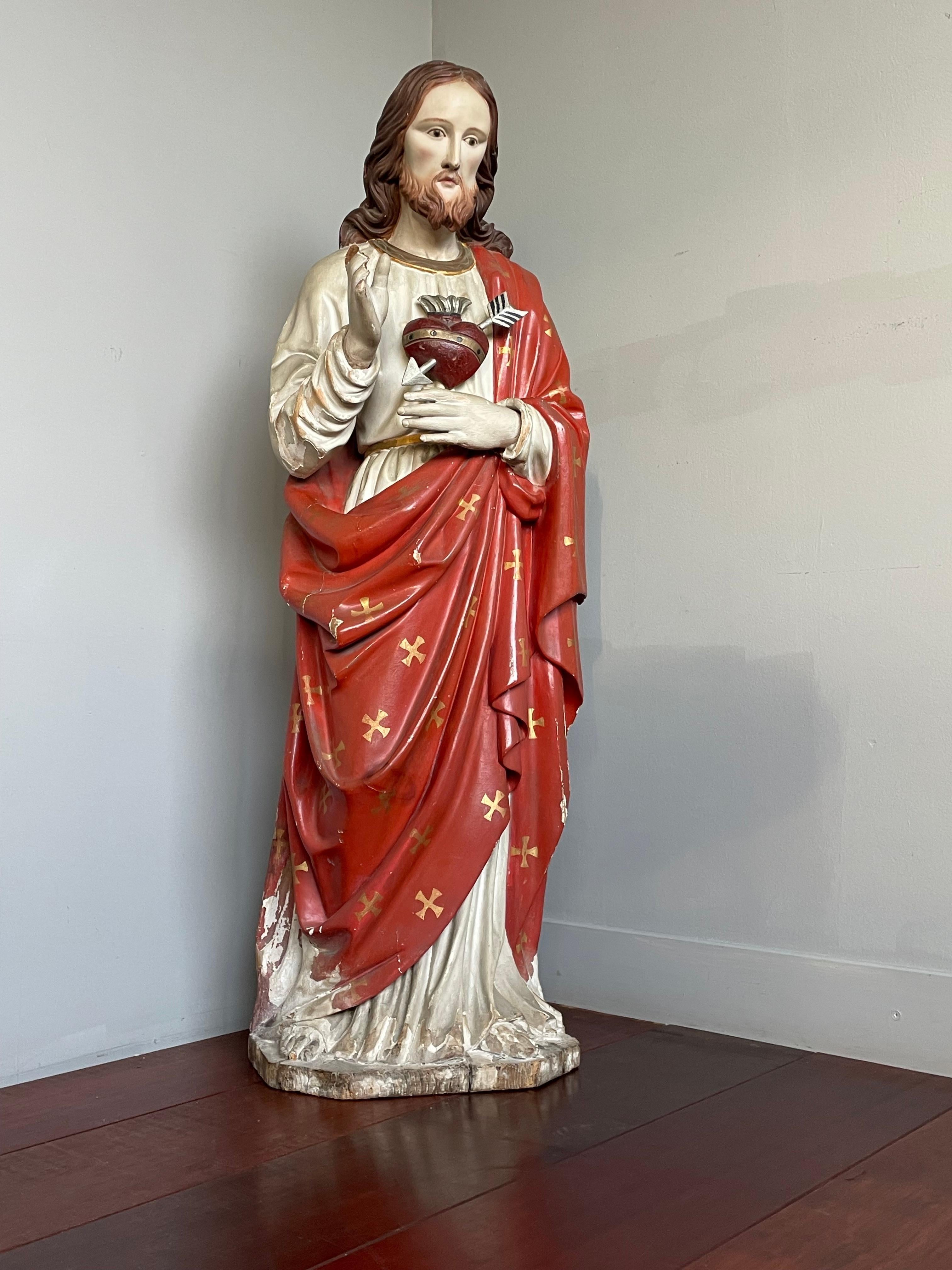 Striking and meaningful work of religious art.

This beautifully hand carved and over three feet tall, wooden Sacred Heart of Christ statue is another one of our recent great finds. In our view the sculptor has perfectly managed to capture both the