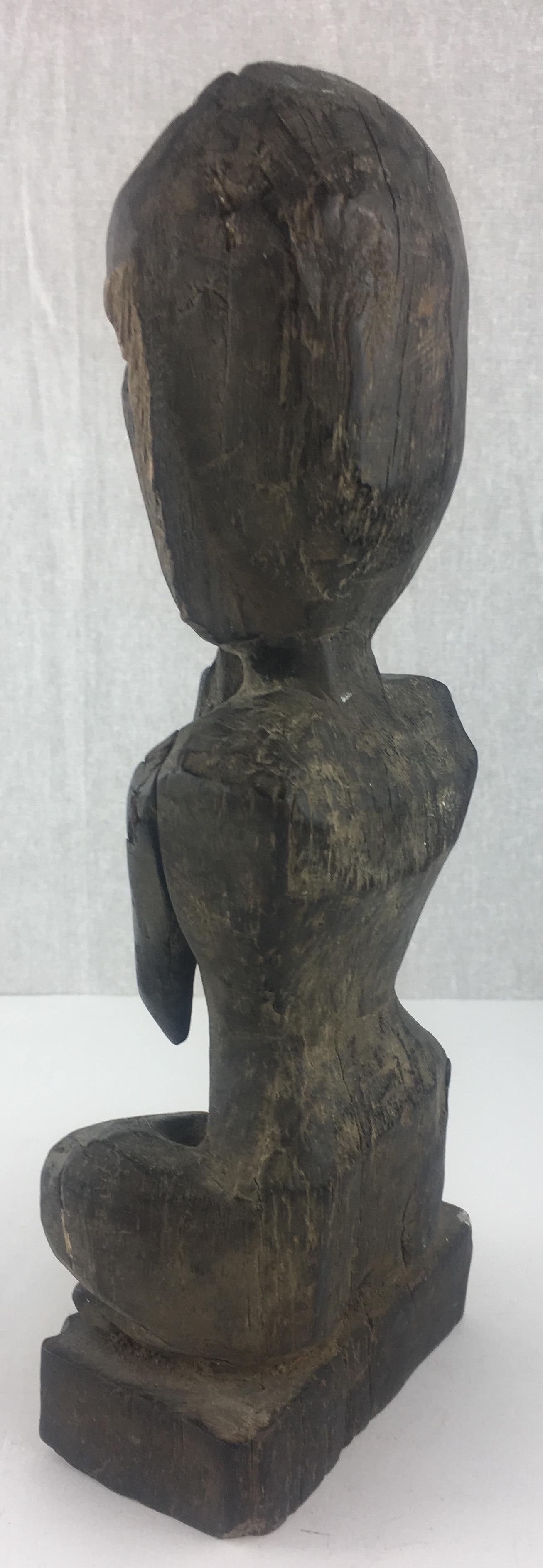 Beautiful vintage hand carved wooden statue of a woman in a yoga or meditation pose. 

This statue has a wonderful patina and would be perfect for a yoga studio, meditation room or anywhere.