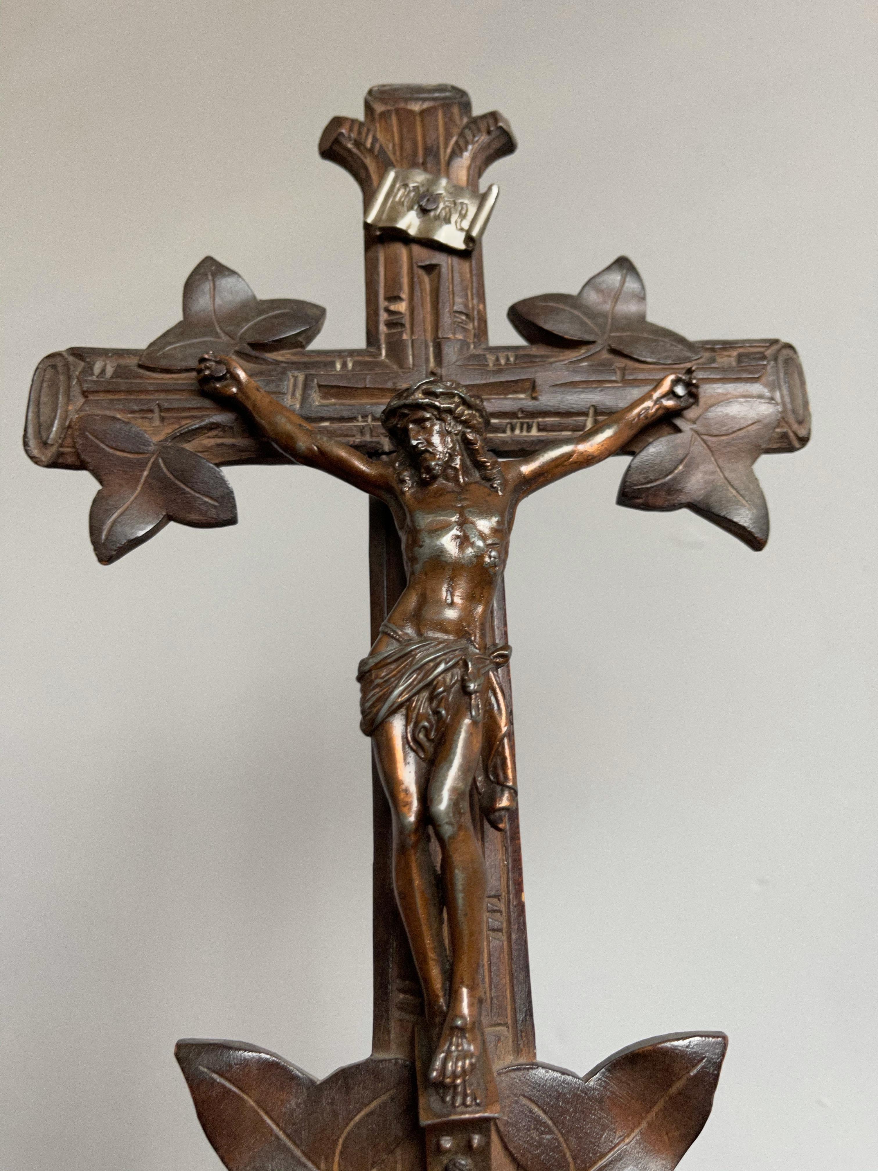 Beautifully hand carved Black Forest cross with matching size corpus.

Over the decades we have sold a number of unique and interesting crucifixes, but we had not yet come across a branches and leafs entwined table cross in the Swiss Black Forest