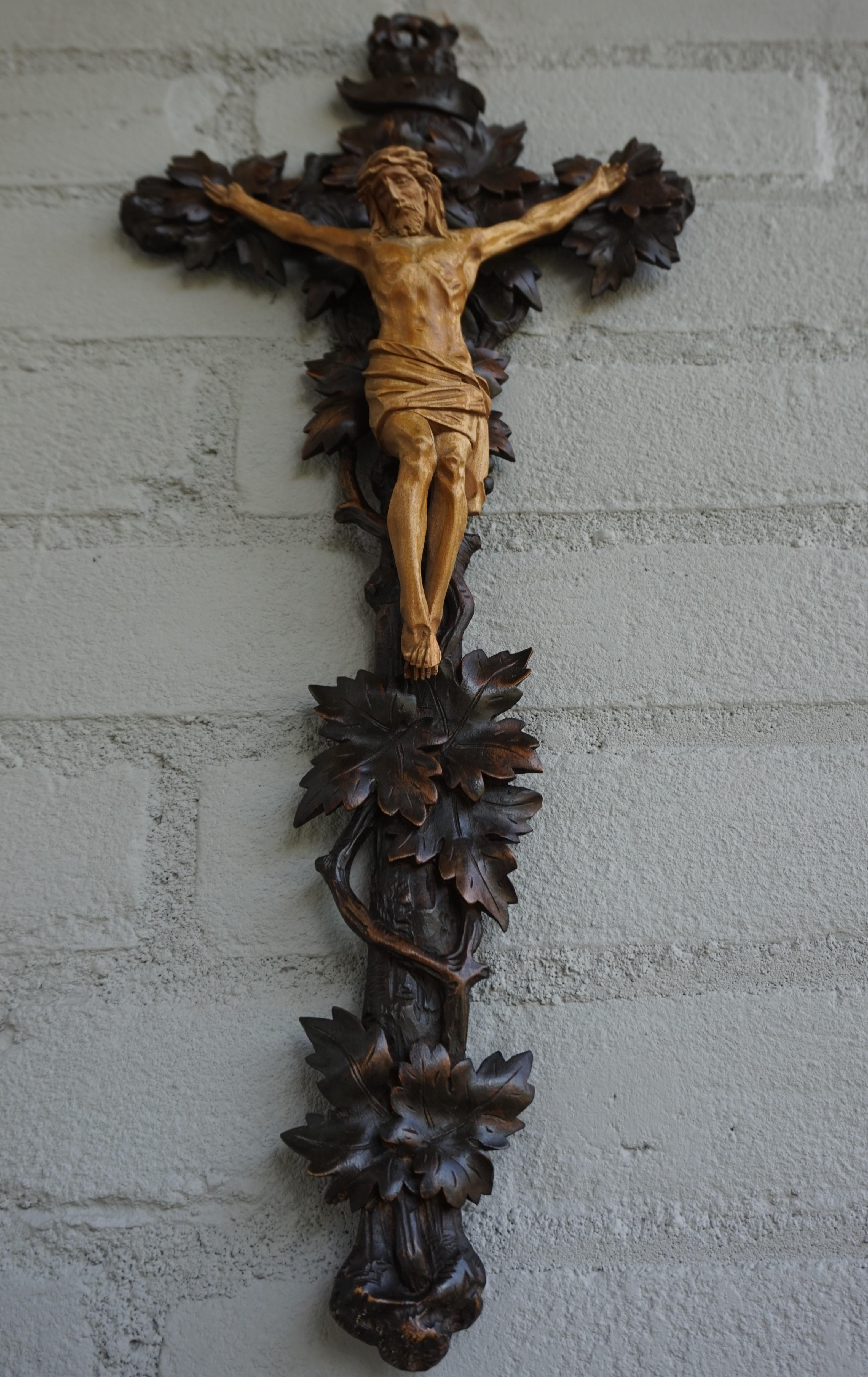 Amazingly hand carved Black Forest cross with matching size corpus.

Over the decades we have sold a number of unique and interesting crucifixes, but we had not yet come across a branches and leaf entwined cross in the Swiss Black Forest style. To