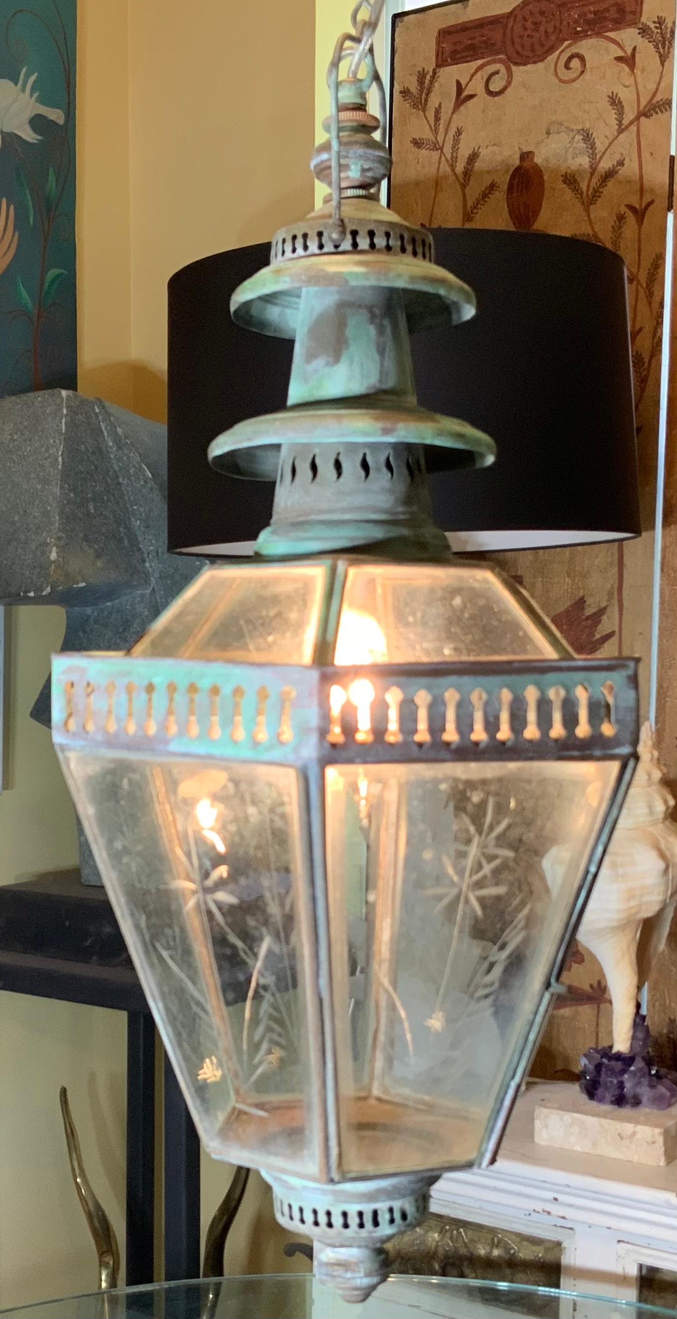 Beautiful funky hanging lantern hand crafted from copper by artisan craftsman , hand beveled glass and floral etching on it .
Newly electrified with one 60/watt light . Will look great in any room. Not suitable for wet locations.
Original chain