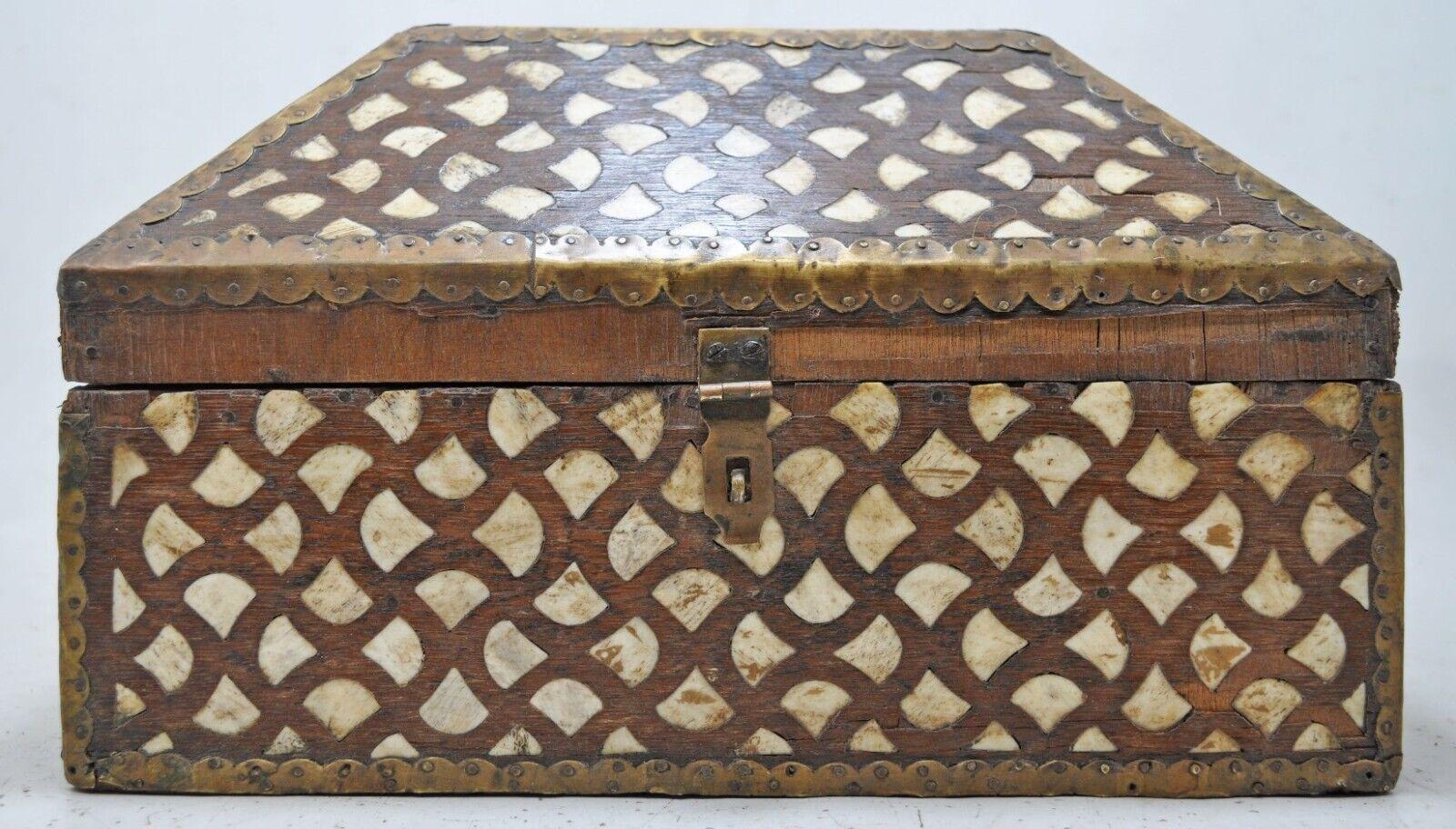 Antique Hand-Crafted Decorative Box with Distinctive Bone Inlay Pattern and Nailed Brass Trim

Anonymous
India; early-to-mid 20th century
Wood, bone and brass

Approximate size: 12.2 x 9.2 x 6.8 in.

A distinctive rustic dome-lidded box suitable for