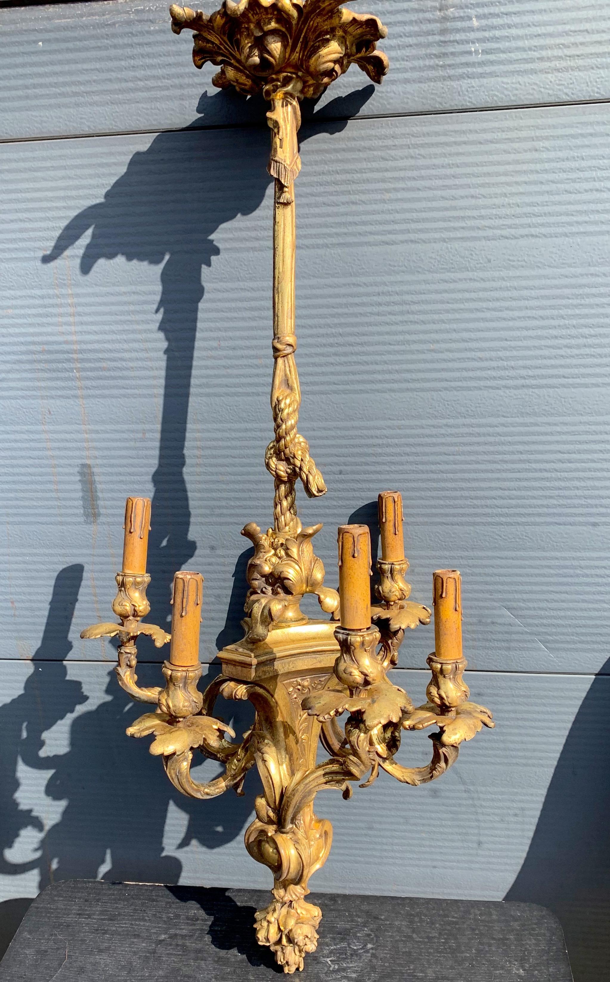 Stunning floral theme chandelier from the late 1800s. 

If you are looking for a truly stylish, well proportioned and top museum quality antique fixture then this work of lighting art from the late 19th century could be perfect for you. The overall