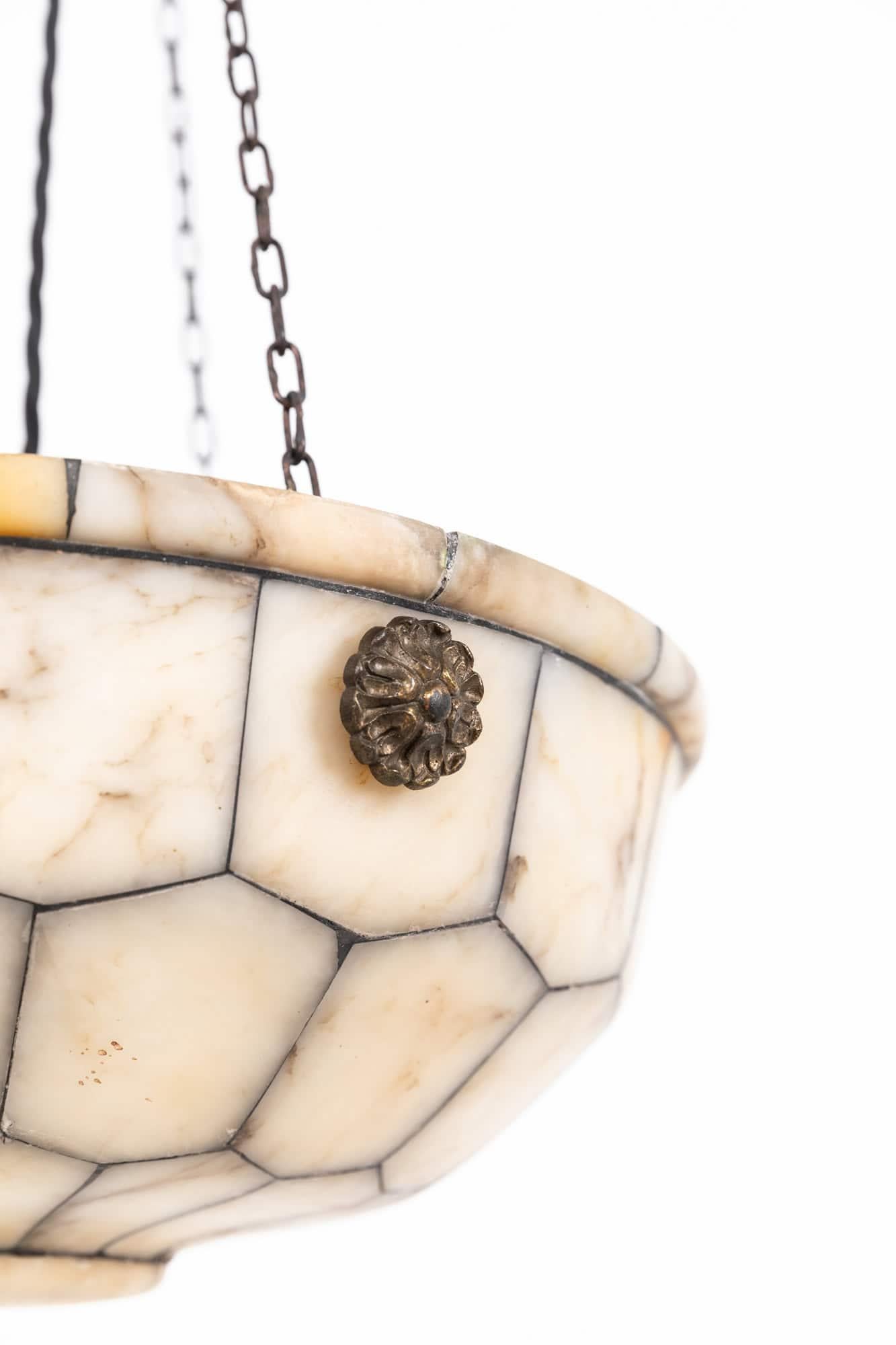 

An incredibly elegant alabaster plafonnier pendant light. c.1900

Beautiful individual marbled sections of alabaster, hand crafted together in the same fashion as a stained glass window with lead between. Complete with an equally elegant cast