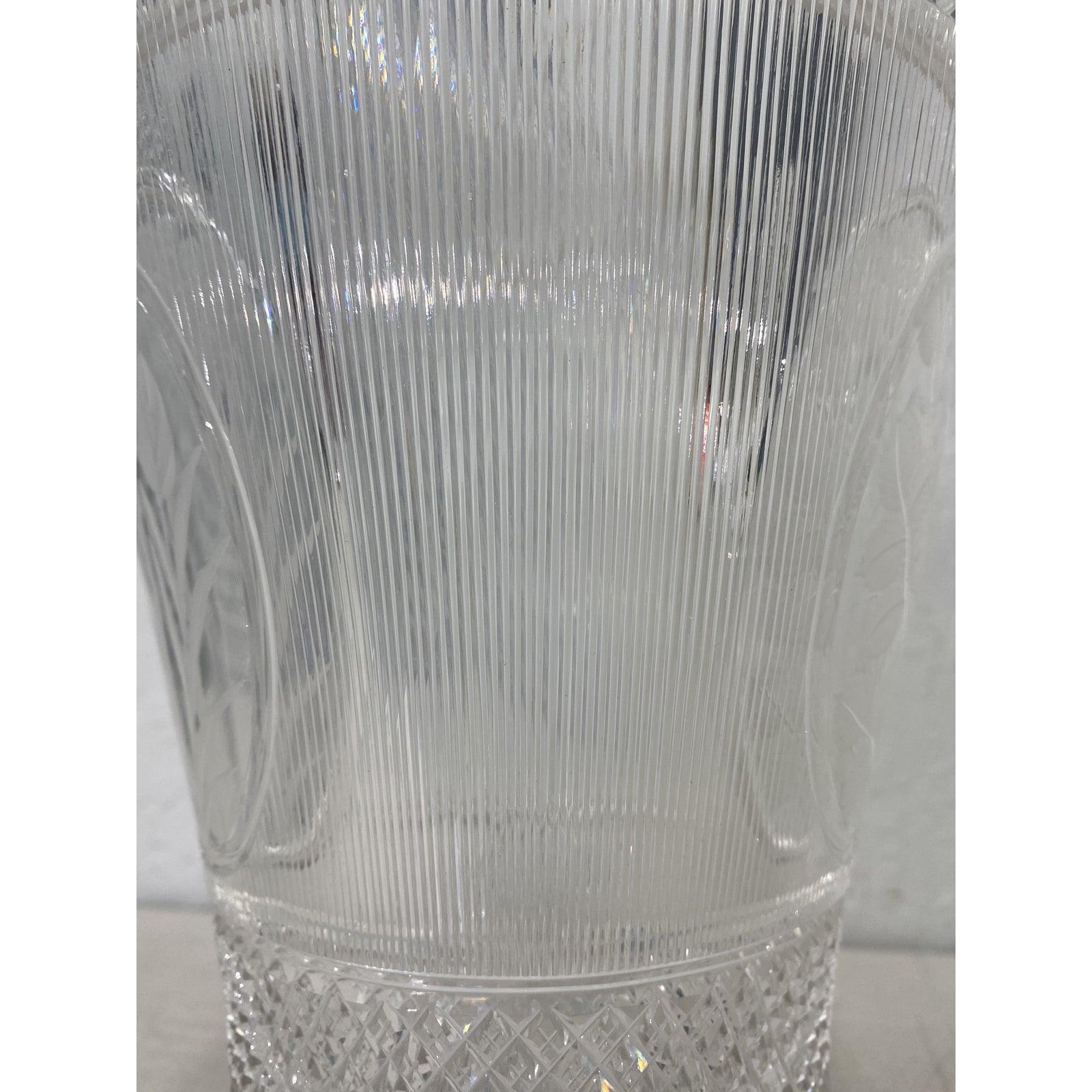 Antique handcut crystal vase with floral and grape motif, circa 1920

An absolutely gorgeous handcut crystal vase. We have found no information on the maker, but the quality cannot be overstated. Lovely main body floral medallions and smaller