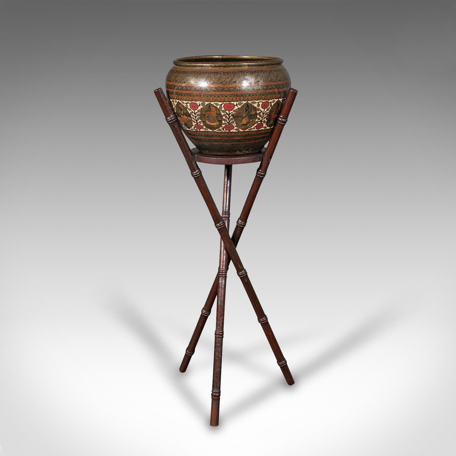 This is an antique hand etched planter stand. A Colonial Indian, decorative brass jardiniere, dating to the Victorian period, circa 1900.

Adorned with copious detail and charm
Displays a desirable aged patina and in good order
Hand-etched and