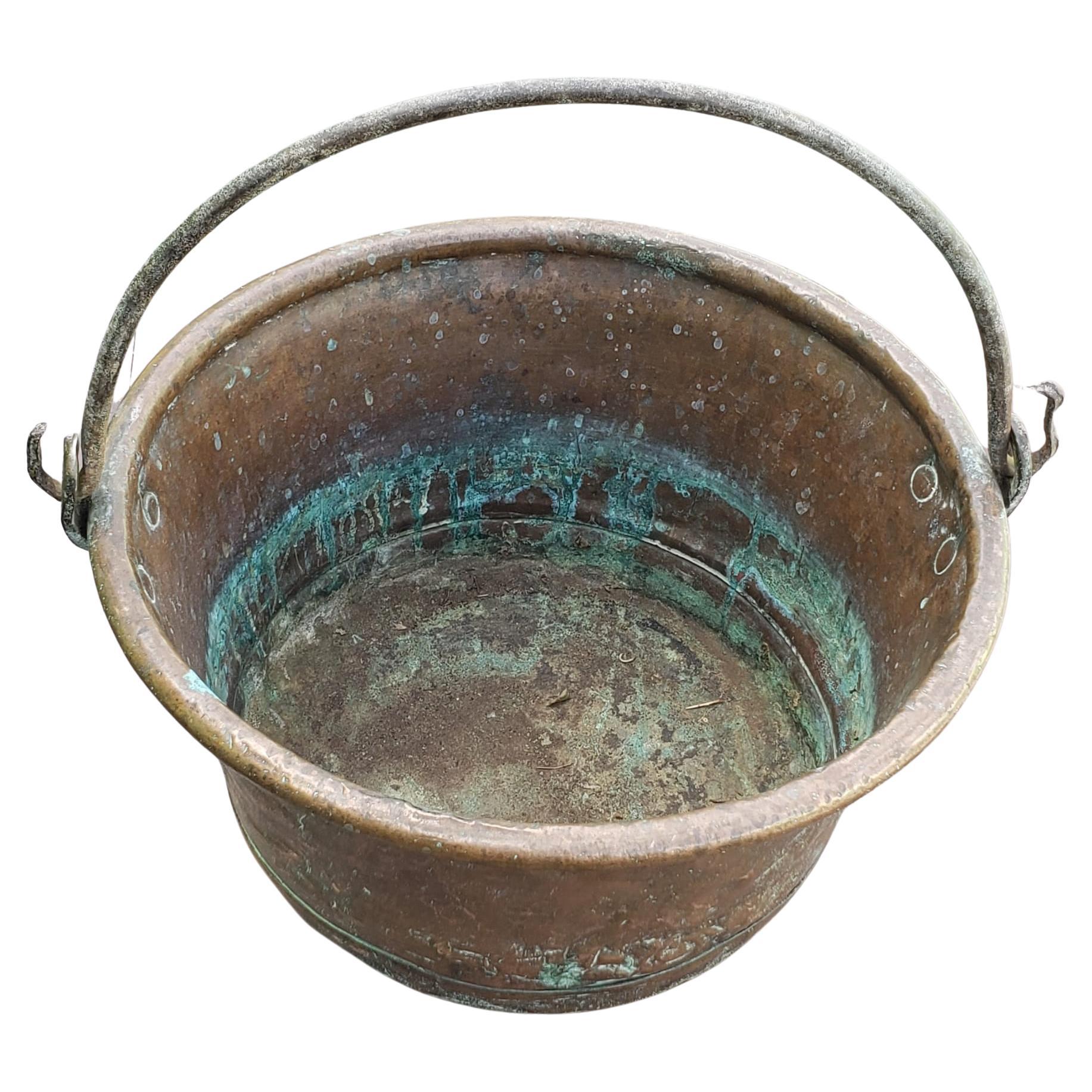 Antique Hand-Hammered Copper Bale with Iron Handle Bucket Jardiniere. 
Measures 15.5