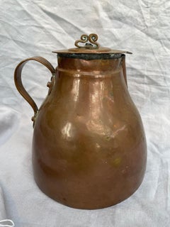 Antique hand-hammered copper pitcher