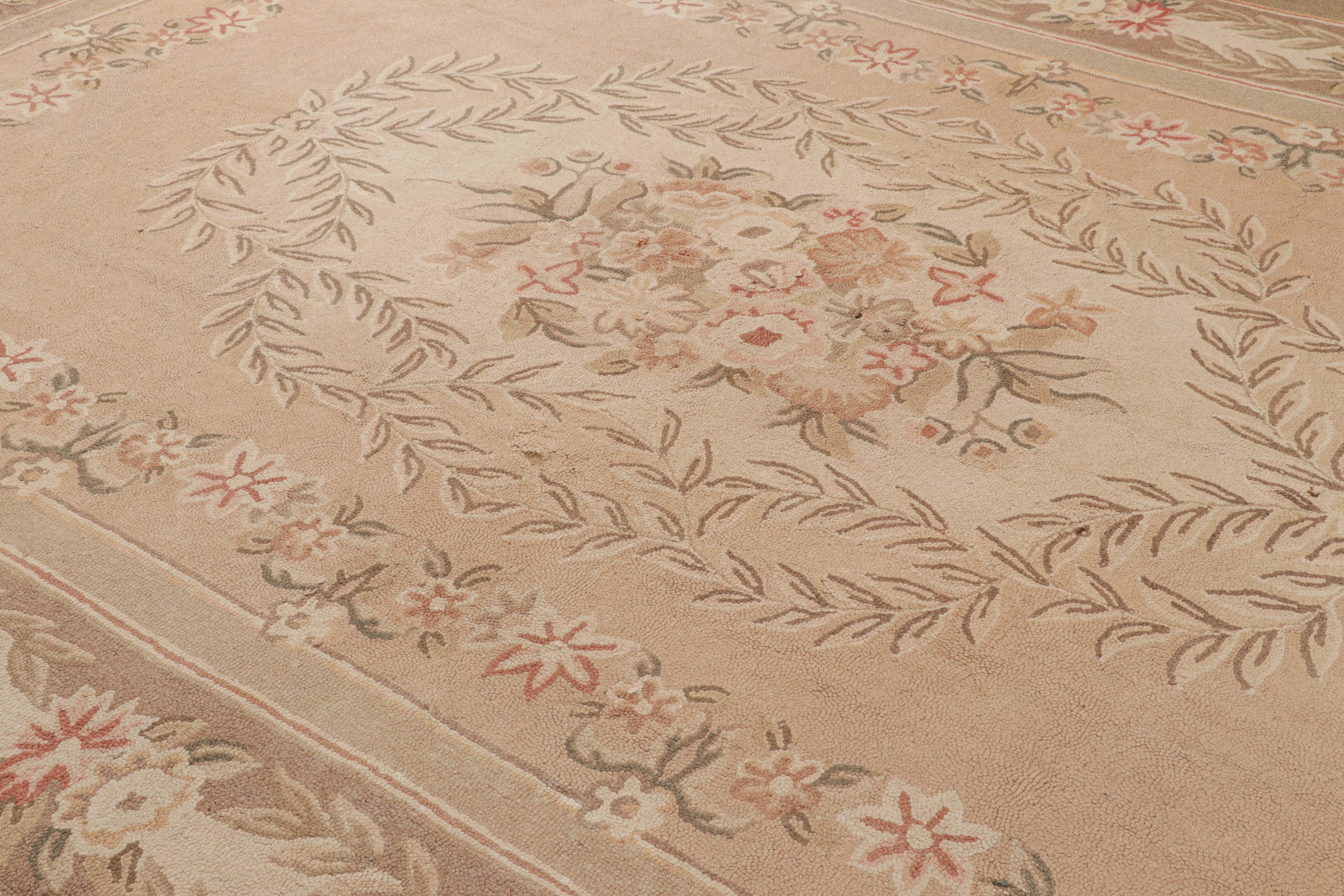 Hand-hooked in wool originating from China circa 1910-1920, this 10×14 antique rug connotes a hooked design in a distinguished medallion pattern—enjoying brown and pink colors in good condition.