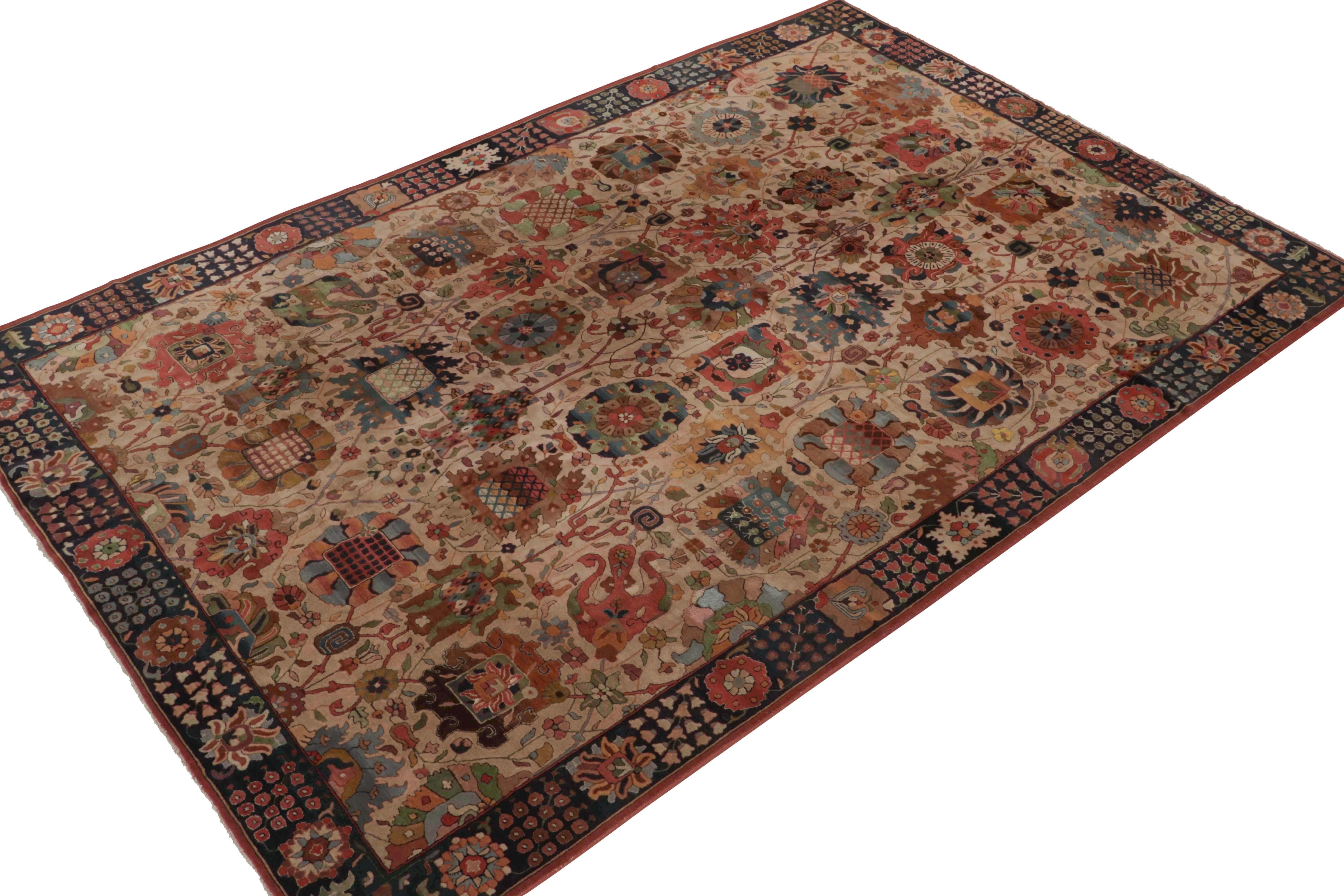 A rare 8x12 antique hand-hooked rug of German provenance, handmade in wool circa 1920-1940. 

This collectible piece enjoys floral patterns in rust-red and green on a beige backdrop within a dark-blue border. Keen eyes will note the intricate