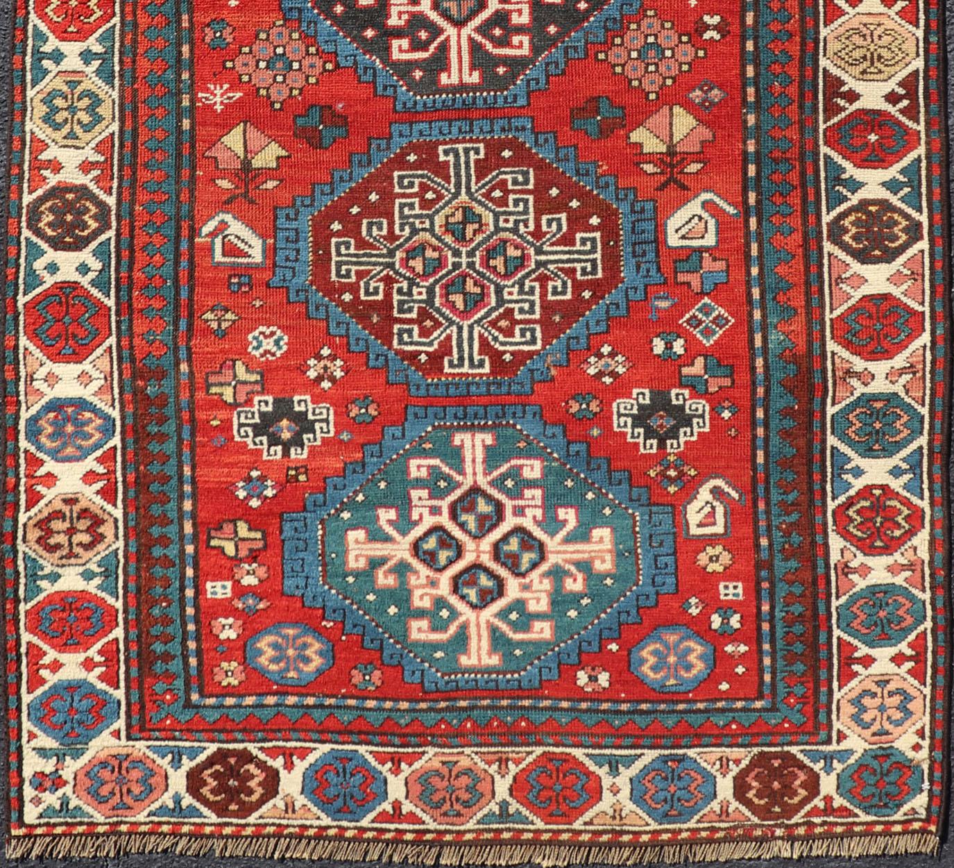 Hand-Knotted Antique Hand Knotted Caucasian Kazak Rug in Brilliant Red with Geometric Design For Sale