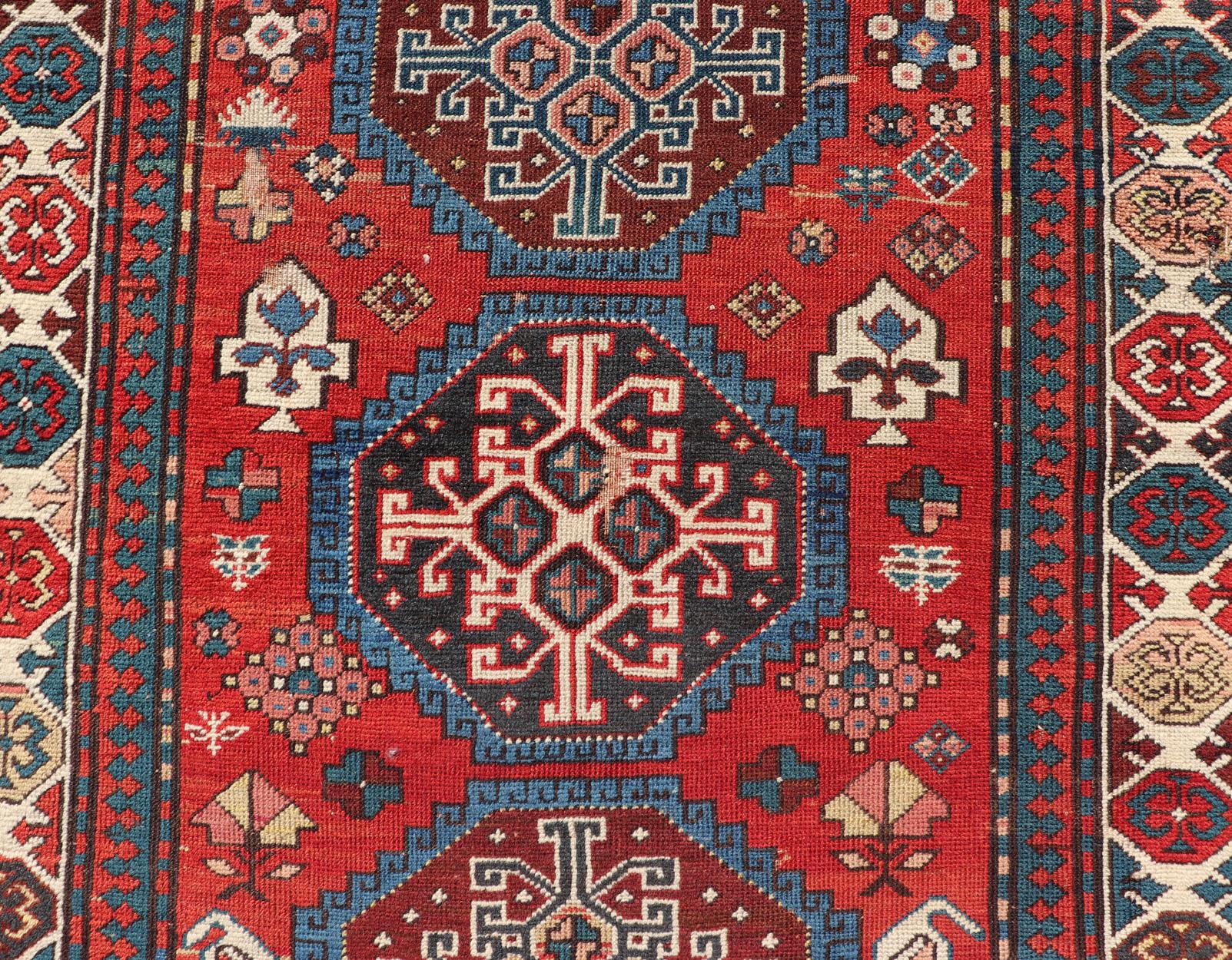 Wool Antique Hand Knotted Caucasian Kazak Rug in Brilliant Red with Geometric Design For Sale