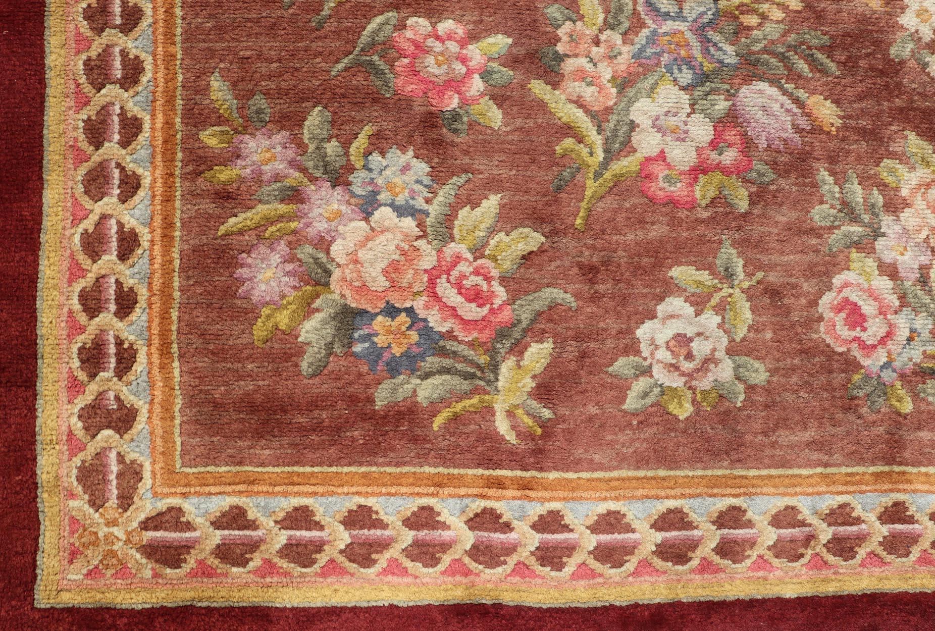 This European Savonnerie Rug has been hand-knotted in late 19th century in France. Owned by Coca-Cola magnate Robert W. Woodruff between 1948 until the late 1980s at his Windcrofte estate, the rug features an all-over floral design. The entirety of