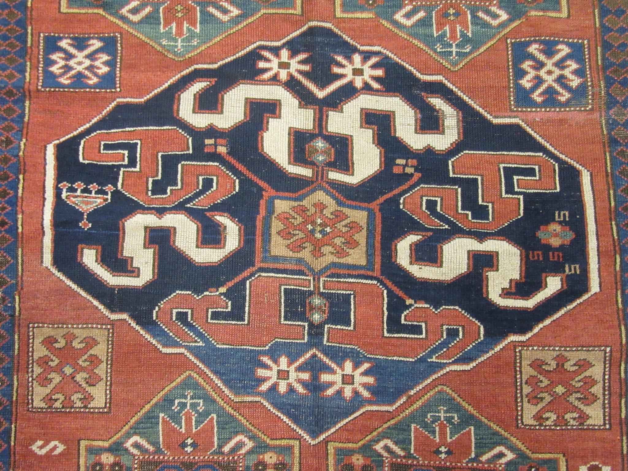 20th Century Antique Hand Knotted Kazak Rug For Sale