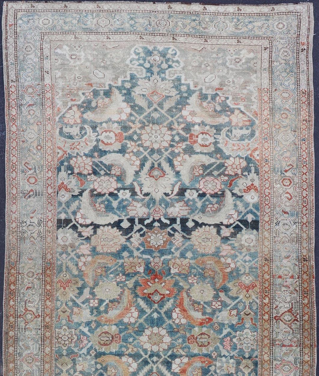 Antique Kurdish runner antique with floral motifs Hand Knotted
rug W22-0205, country of origin / type: Iran / Kurdish, circa 1900.

This Kurdish Gallery Runner from early 20th century Persia is characterized by its all-over design. The piece is