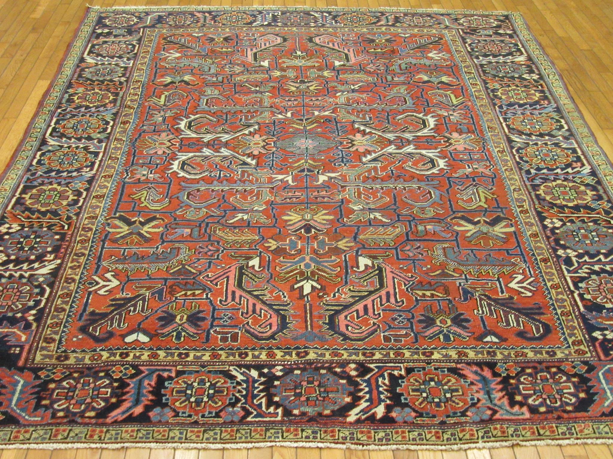 This is an antique hand-knotted Persian Heriz area rug. It is made with naturally dyed wool on cotton foundation. The rug has an all-over geometric pattern exclusive to the Heriz rugs. It measures: 7' 5'' x 9' 6'' and in great condition.