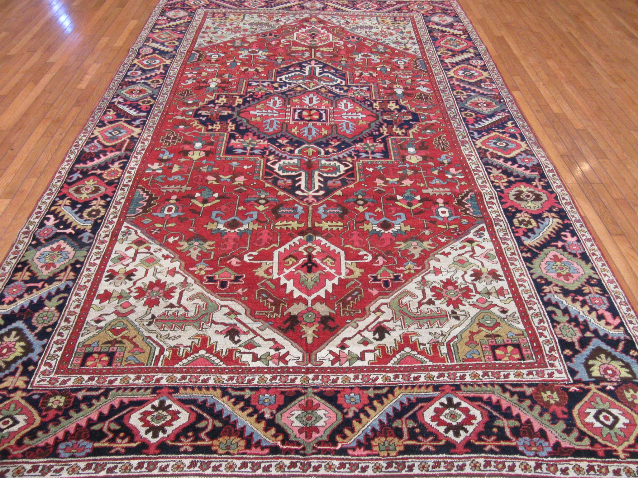This is an antique hand knotted rug from the Infamous village of Heriz in northwest of Iran (Persian).
This rug has the primary colors and geometric design made with wool and natural dyes. A very useful size for your home or office. It measure 7'