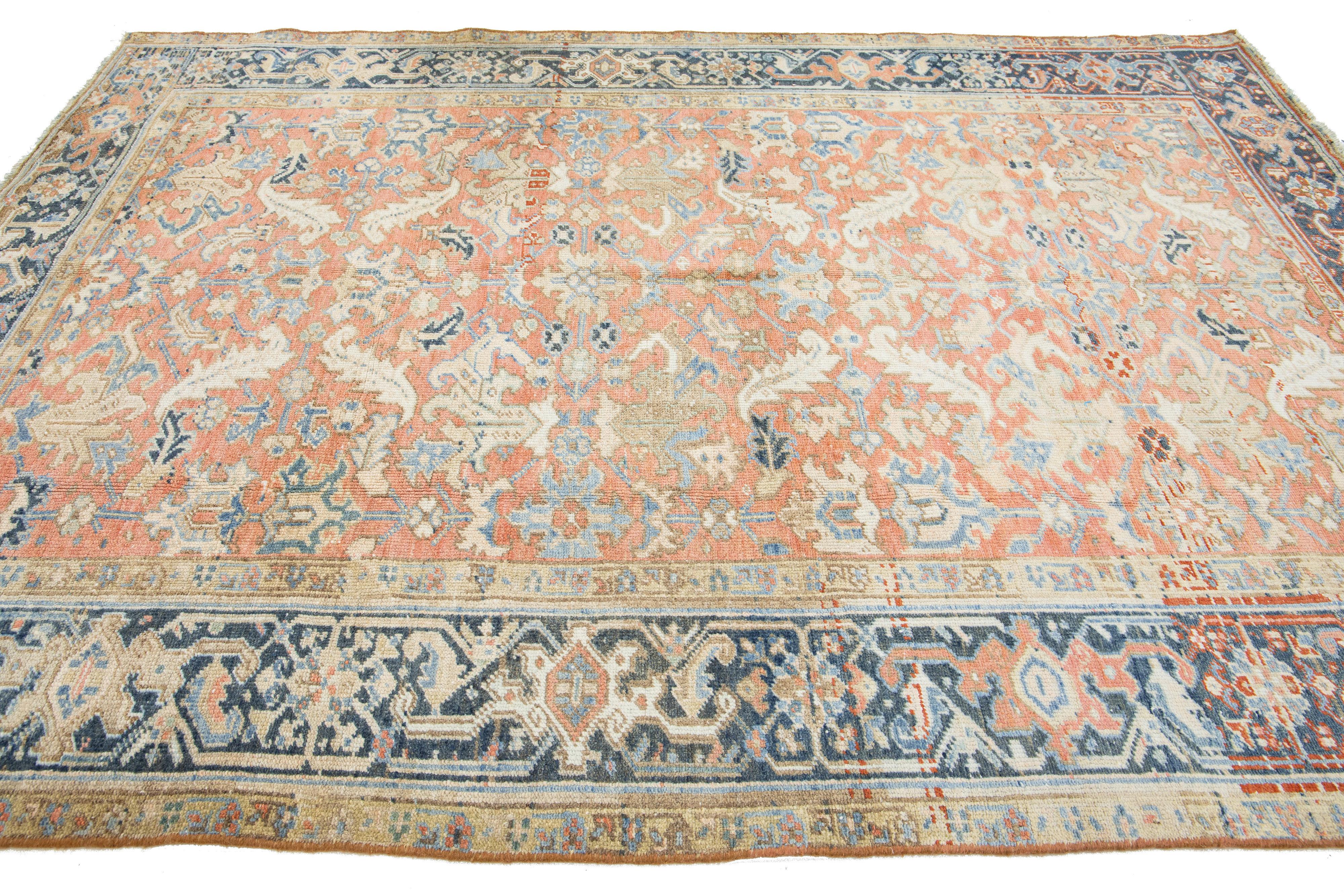 Early 20th Century Antique Hand-knotted Persian Heriz Wool Rug In Peach With Allover Motif For Sale