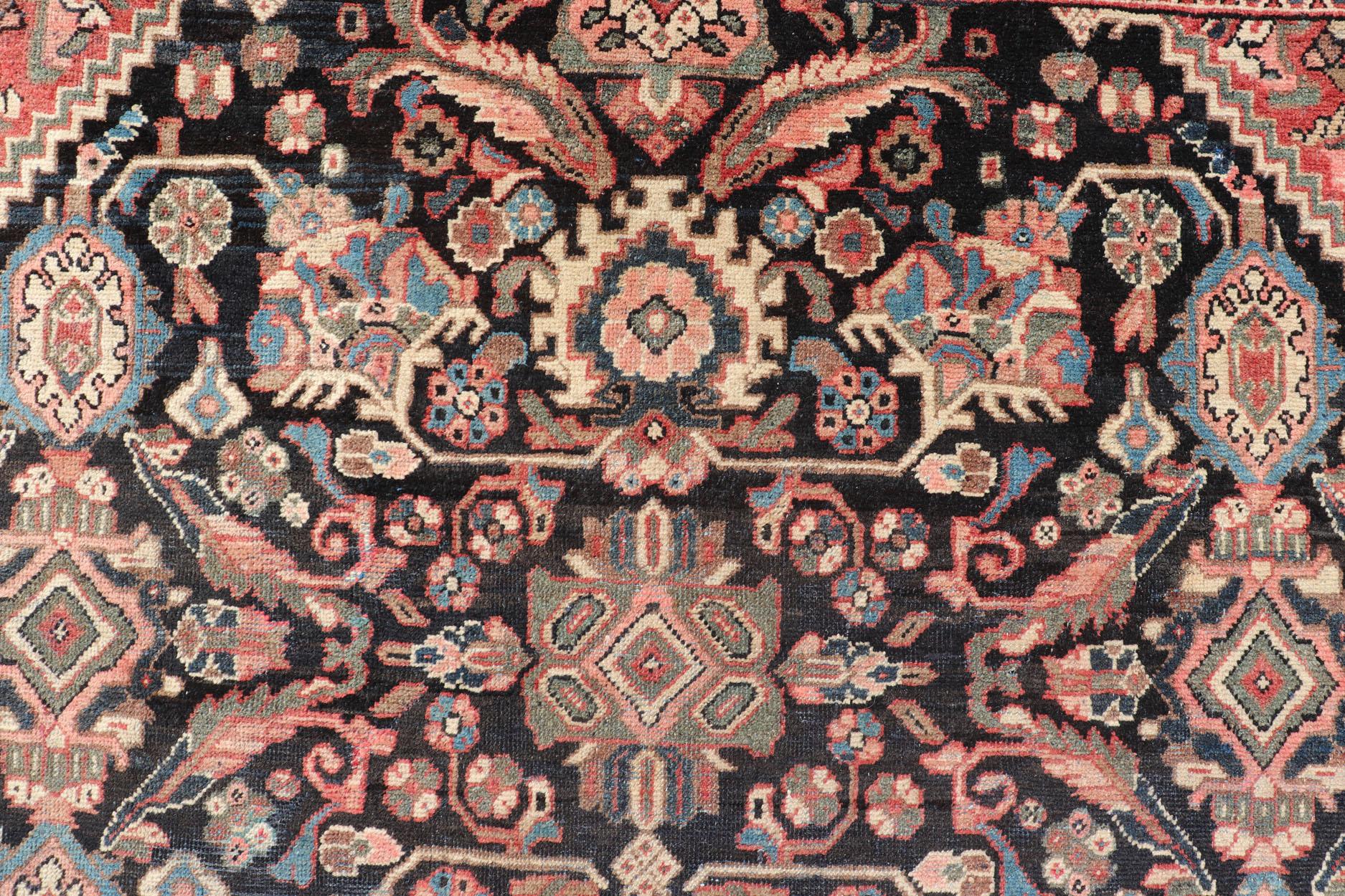 Large Antique Persian Mahal rug with diamond medallion, sub floral design in the background and the border. Colors are dark gray brown background and soft rose in the border and the diamond medallion. Keivan Woven Arts rug/PTA-200716, country of
