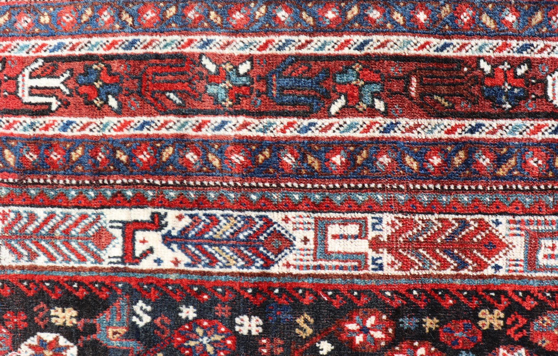 Antique Hand-Knotted Persian Qashqai Rug in Wool with All-Over Tribal Design In Good Condition For Sale In Atlanta, GA