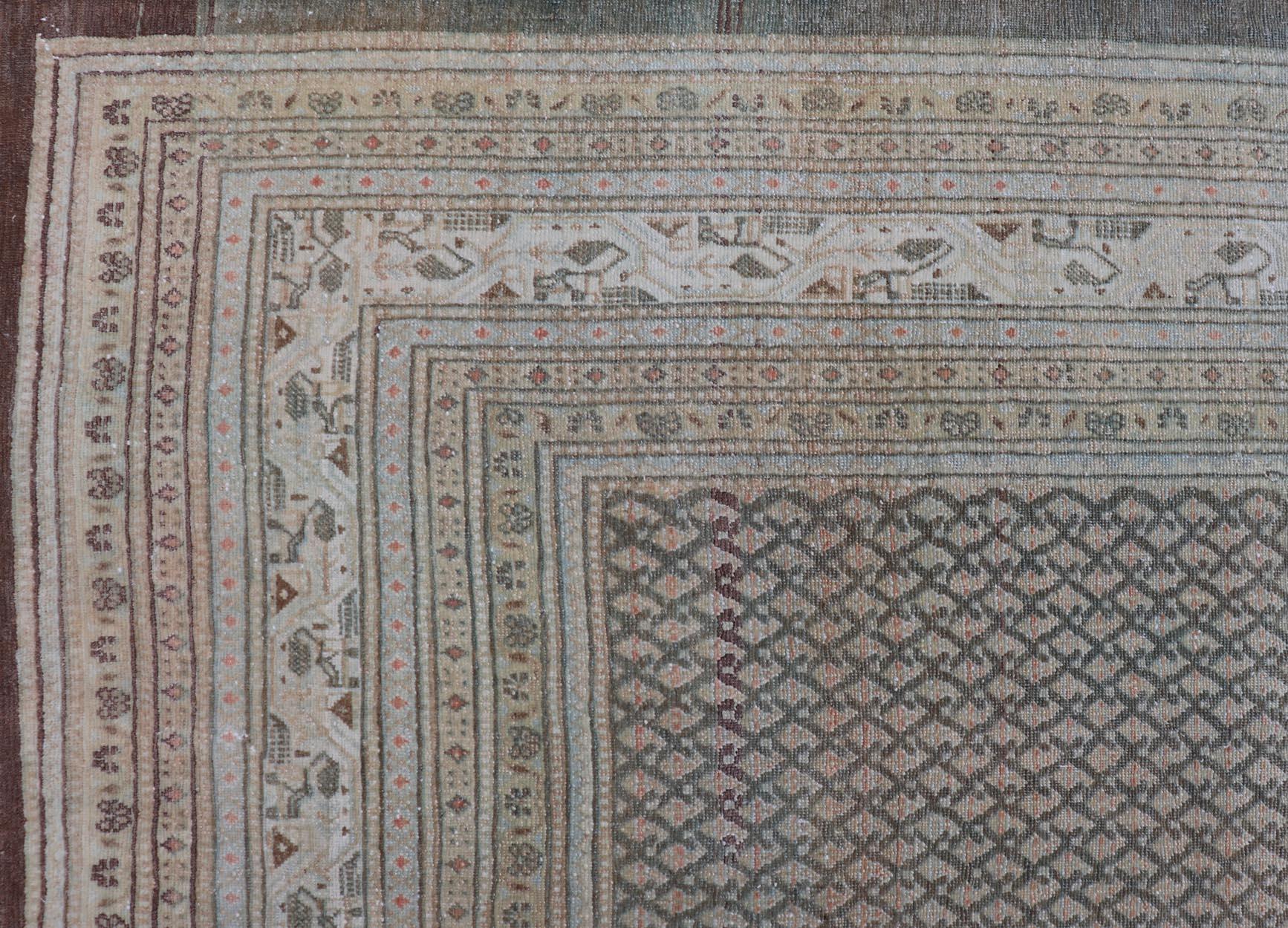 20th Century Antique Hand Knotted Persian Tabriz Rug with All-Over Design in Muted Tones For Sale