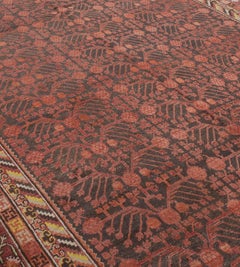 Antique Hand-Knotted Red Pomegranate Khotan Rug