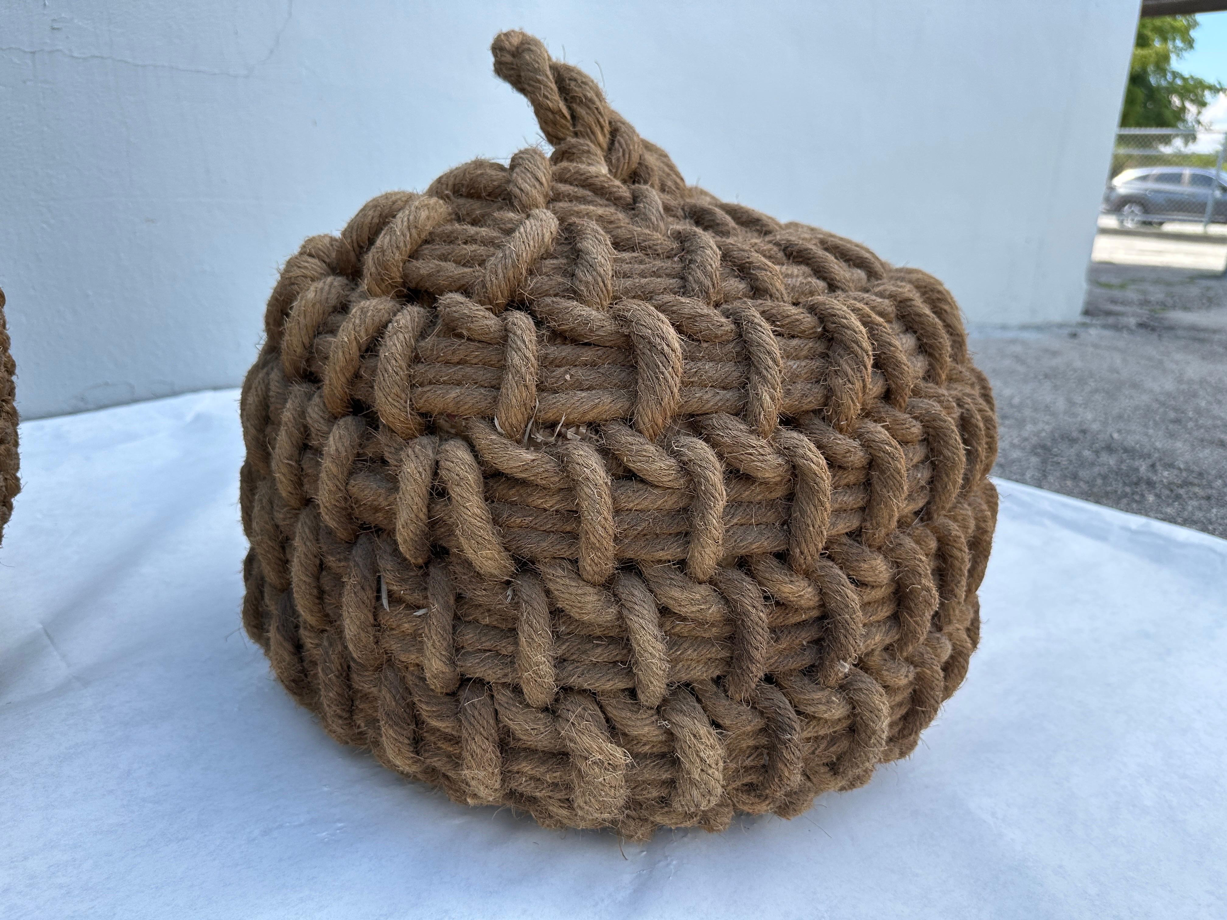 Amazingly decorative, these TWO hand-knotted rope boat fenders are PERFECT for a seaside, natural, relaxed home. They have SO many uses - can be doorstops, accents sculptures, etc. Smaller fender is 18 inches diameter and 16 inches tall.