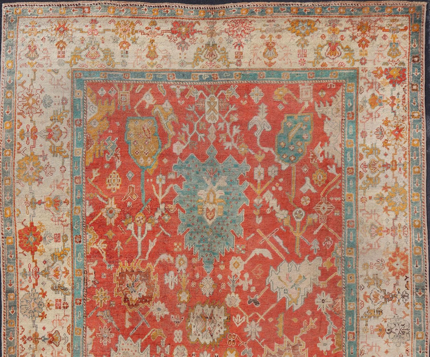 Antique Turkish Oushak In Tribal Motifs in Soft Coral, Blue, Marigold, and Cream For Sale 4