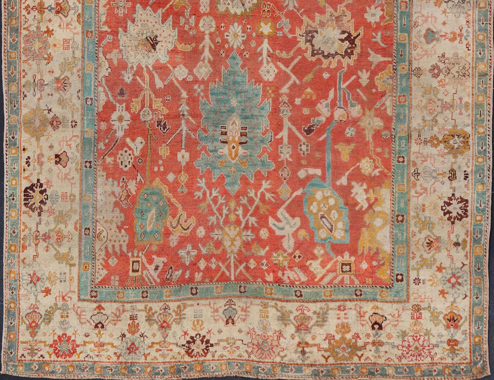 Antique Turkish Oushak In Tribal Motifs in Soft Coral, Blue, Marigold, and Cream For Sale 6