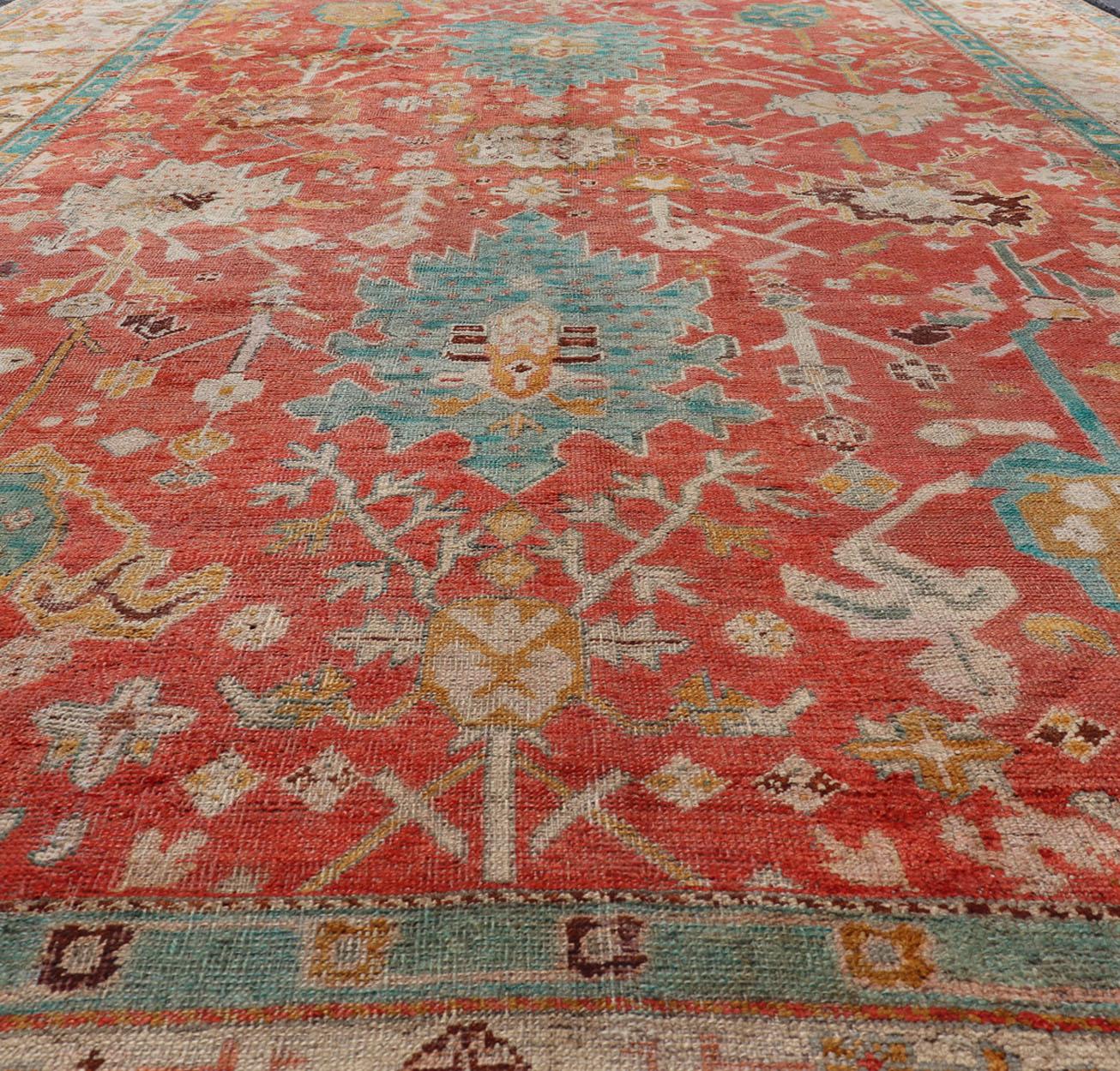 Antique Turkish Oushak In Tribal Motifs in Soft Coral, Blue, Marigold, and Cream For Sale 8