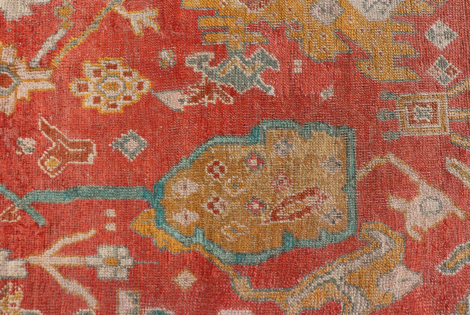 Hand-Knotted Antique Turkish Oushak In Tribal Motifs in Soft Coral, Blue, Marigold, and Cream For Sale