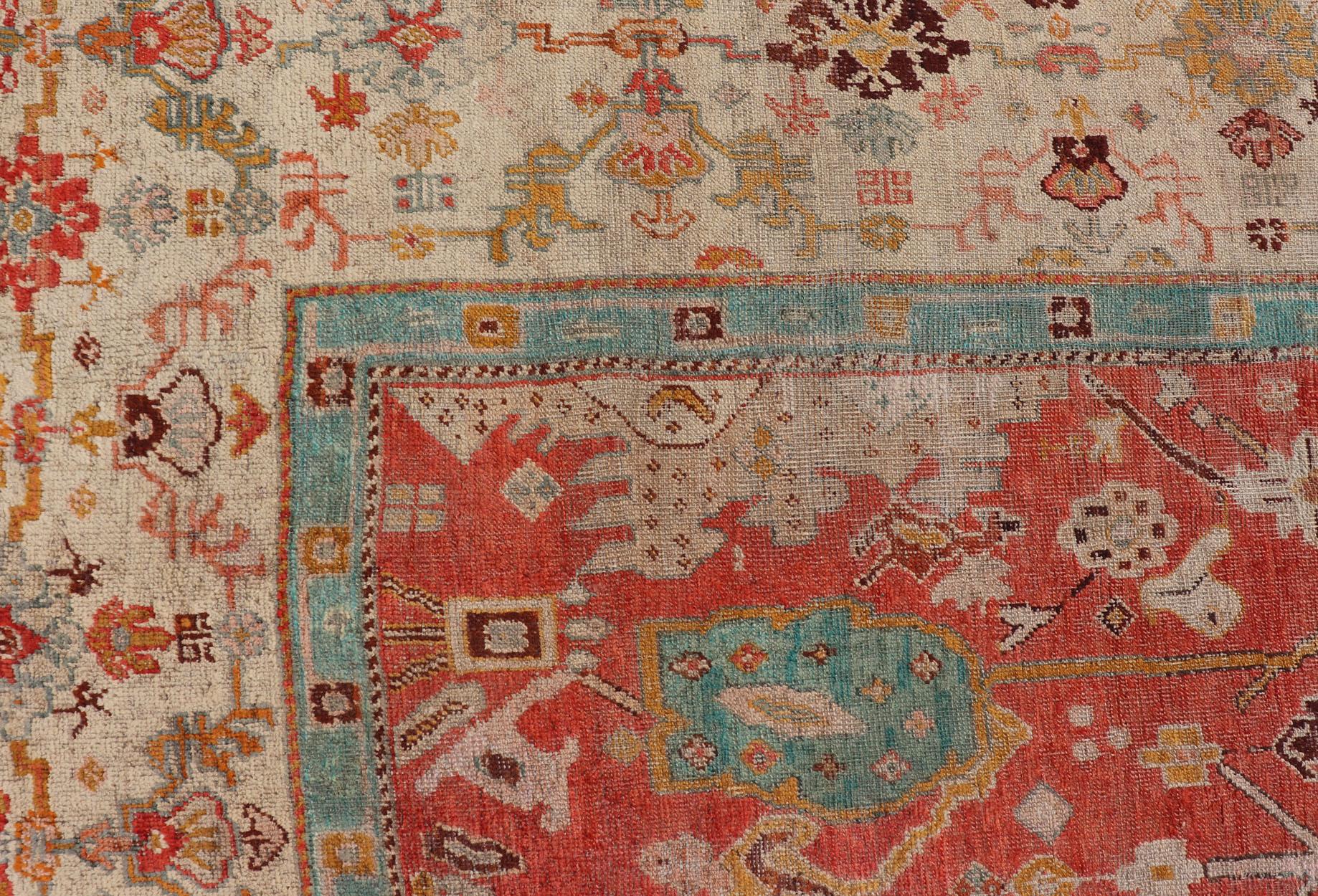 Antique Turkish Oushak In Tribal Motifs in Soft Coral, Blue, Marigold, and Cream For Sale 1