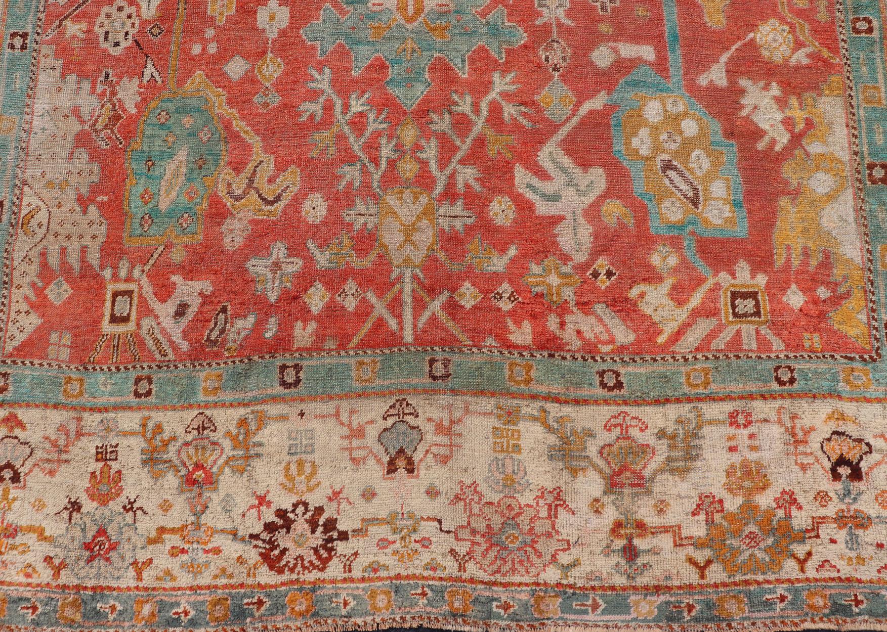 Antique Turkish Oushak In Tribal Motifs in Soft Coral, Blue, Marigold, and Cream For Sale 2