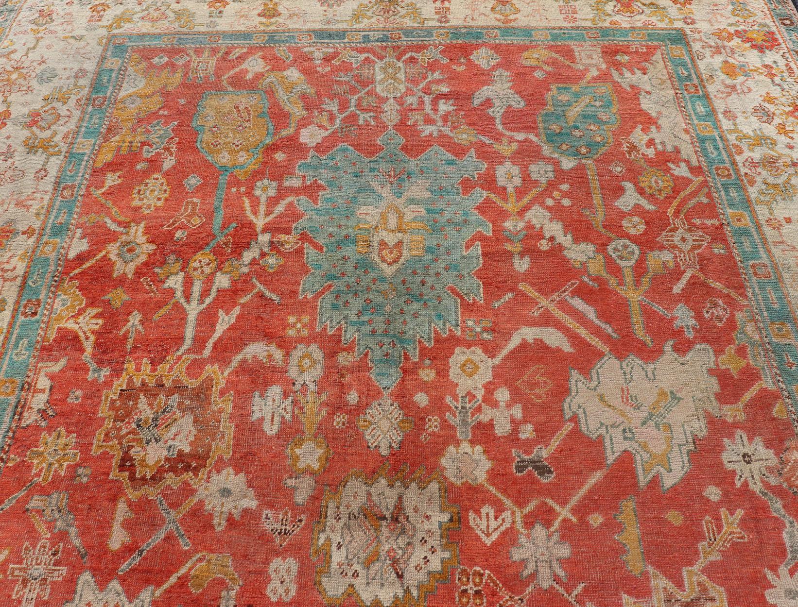 Antique Turkish Oushak In Tribal Motifs in Soft Coral, Blue, Marigold, and Cream For Sale 3