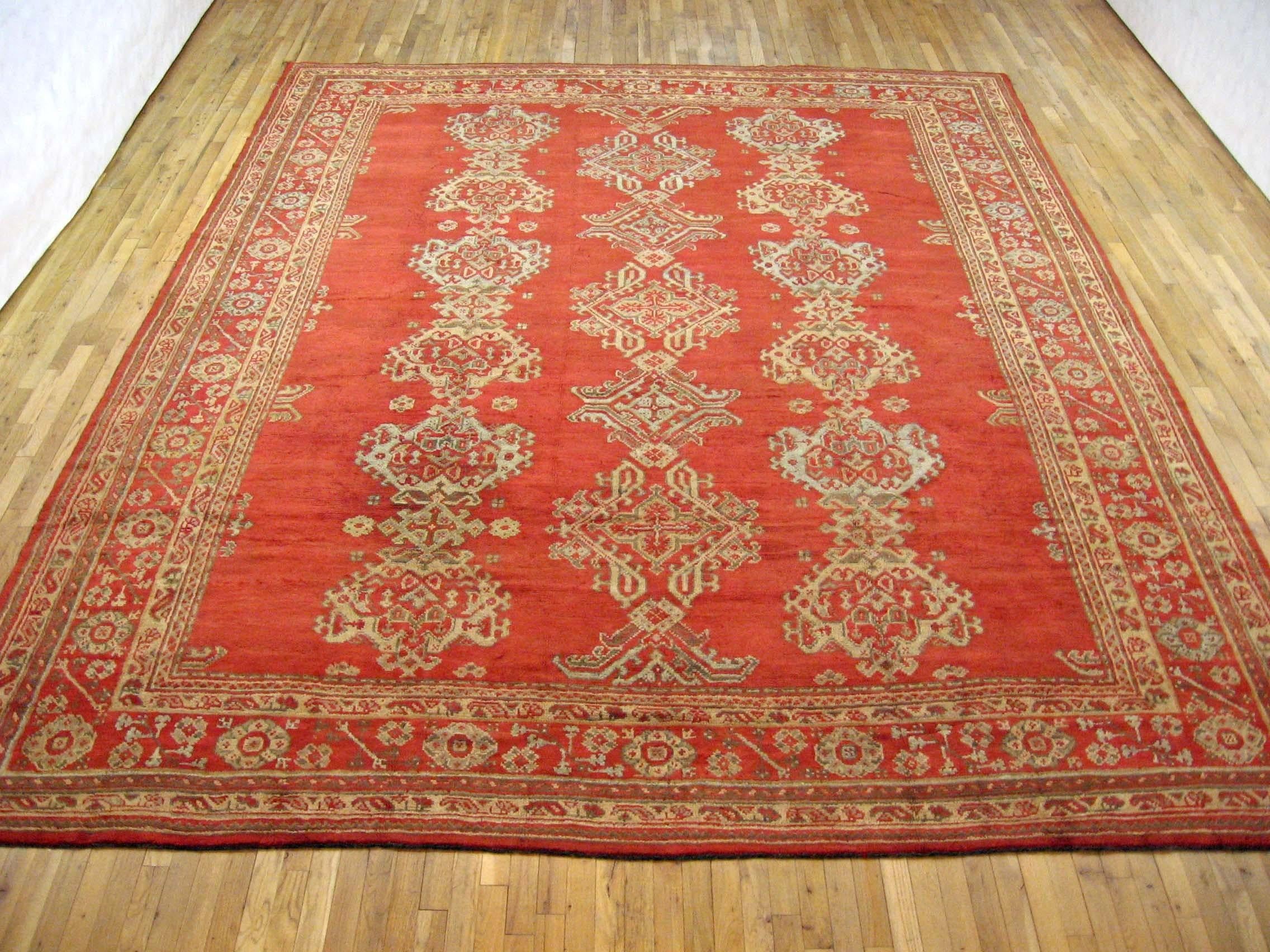 Antique Turkish Oushak Decorative Oriental Carpet, Room size, with Red Field

A gorgeous antique Turkish Oushak carpet, circa 1920, size 13'5 x 10'7. This lovely carpet features multiple medallions in an open field in the red central field. The red