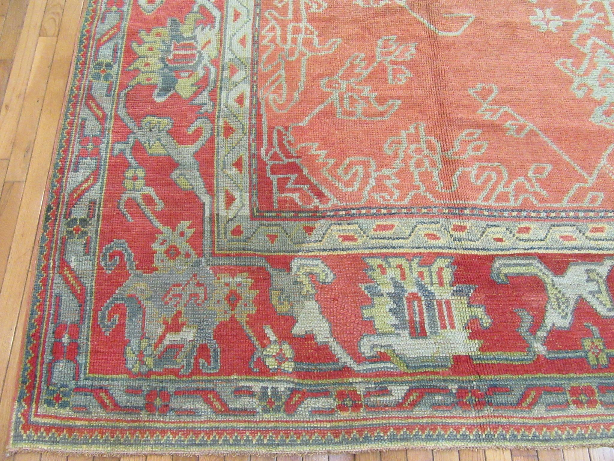 Large Antique Hand-Knotted Wool Coral Red Green Turkish Oushak Rug In Good Condition For Sale In Atlanta, GA